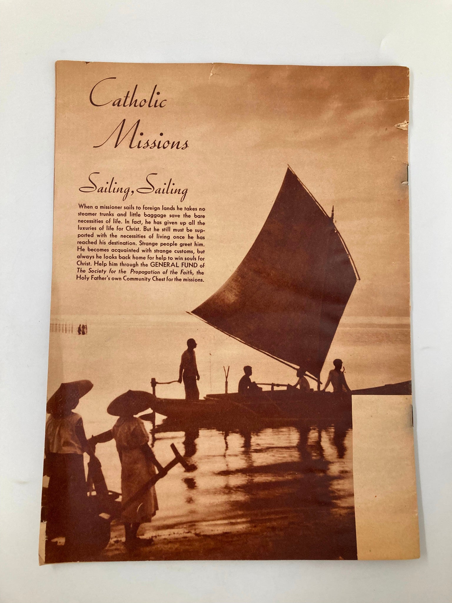 Cover page of VTG Catholic Missions January February 1941, showcasing a picturesque scene of a sailboat at dusk, highlighting the theme of 'Sailing, Sailing' related to mission work.