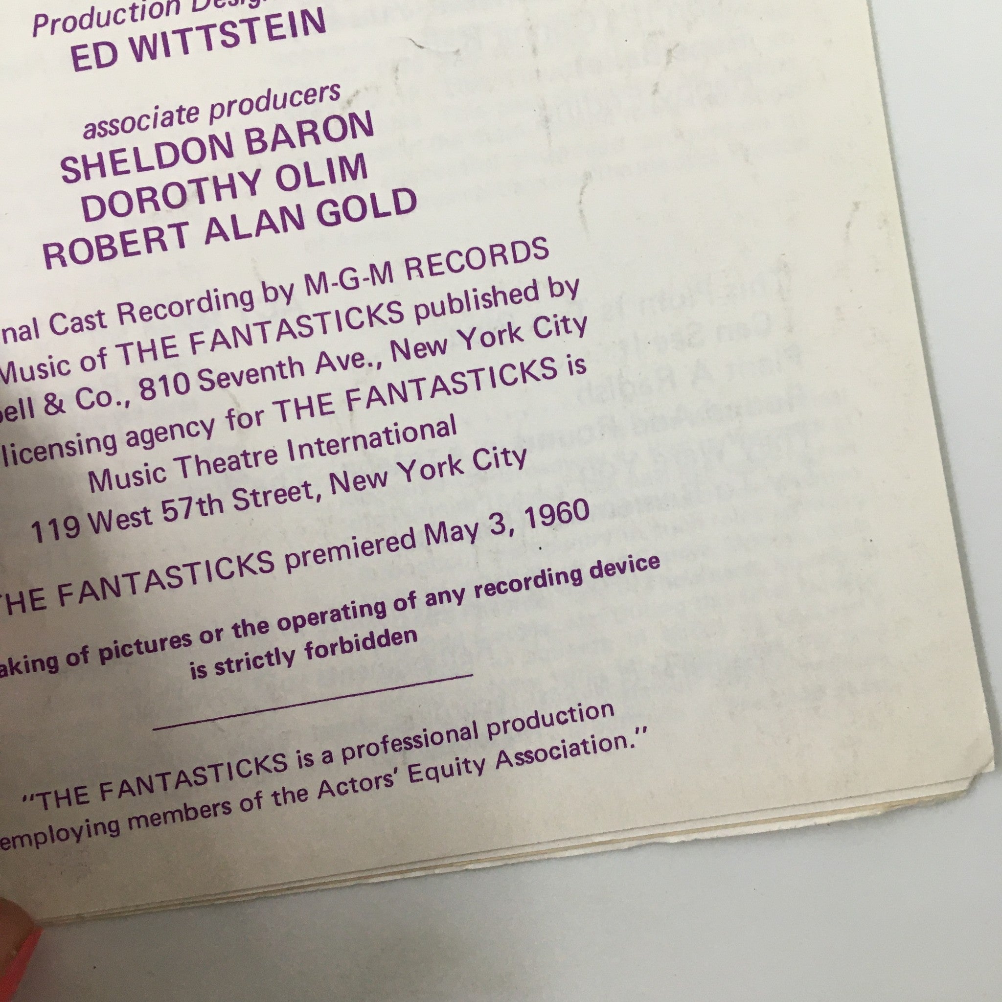 Close-up of production details from the original 1960 Playnews for 'The Fantasticks' by Tom Jones, including credits for design and production.