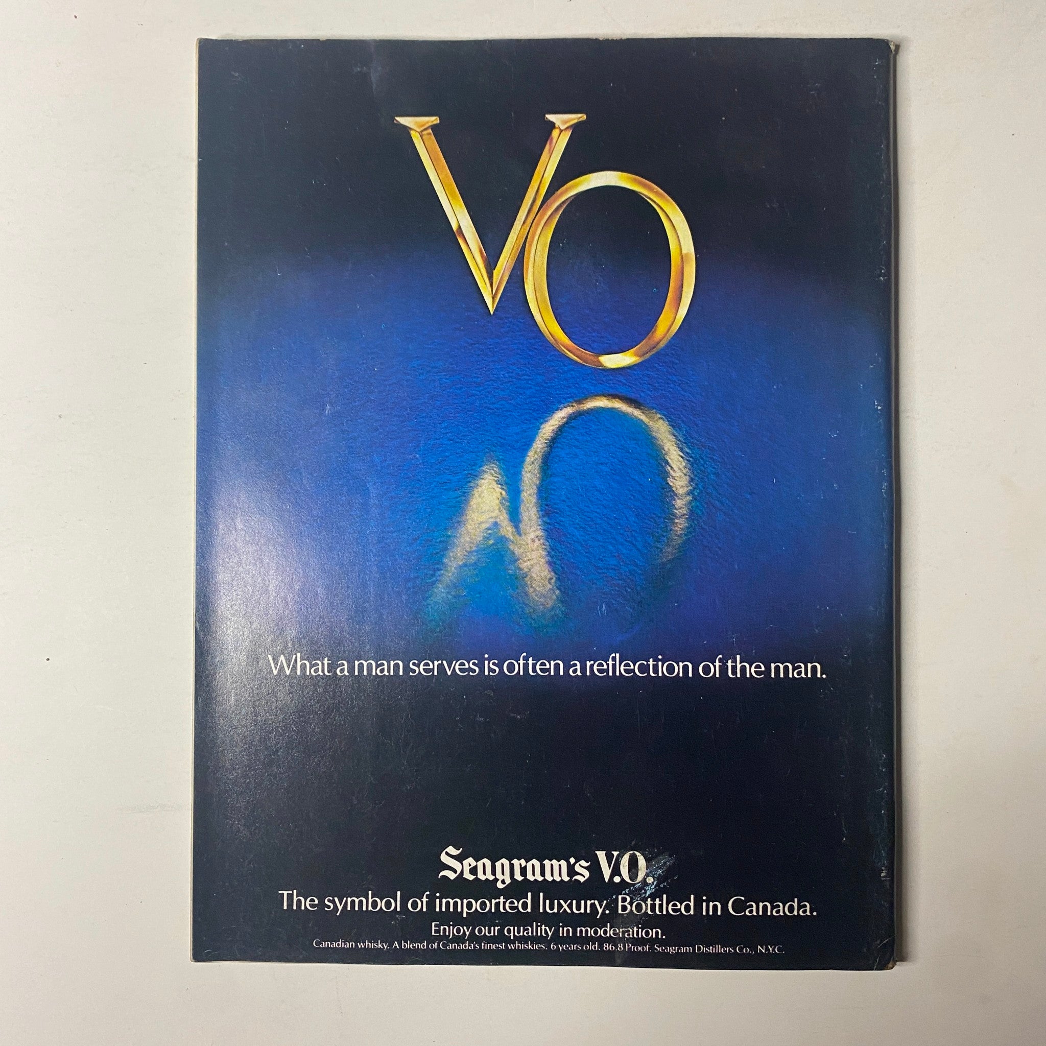 Advertisement for Seagram's V.O. whiskey in Forbes Magazine from March 5, 1979, with the tagline about reflection and showcasing a luxurious branding design.