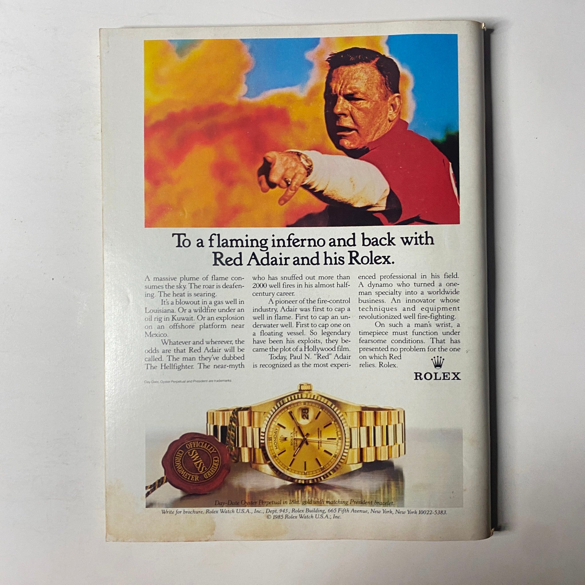 Advertisement page from Forbes Magazine, November 17, 1986, promoting Rolex watches with an image of a man against a backdrop of flames.