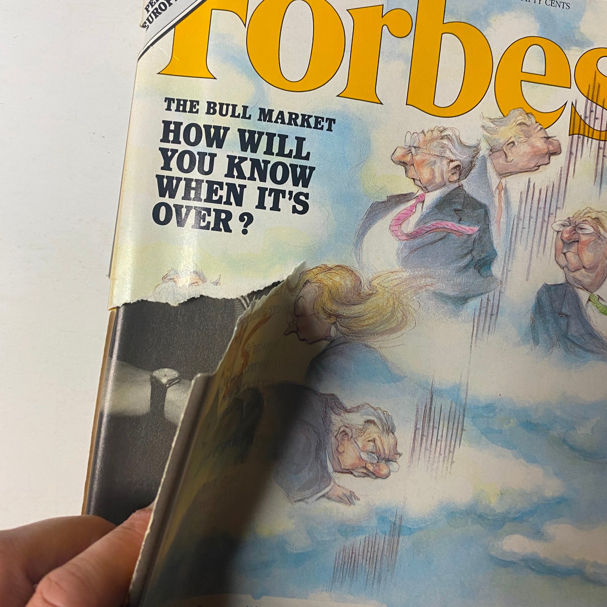 Close-up view of the cover of Forbes Magazine, May 4, 1987, showing the playful illustration related to stock market predictions and the prominent title question.
