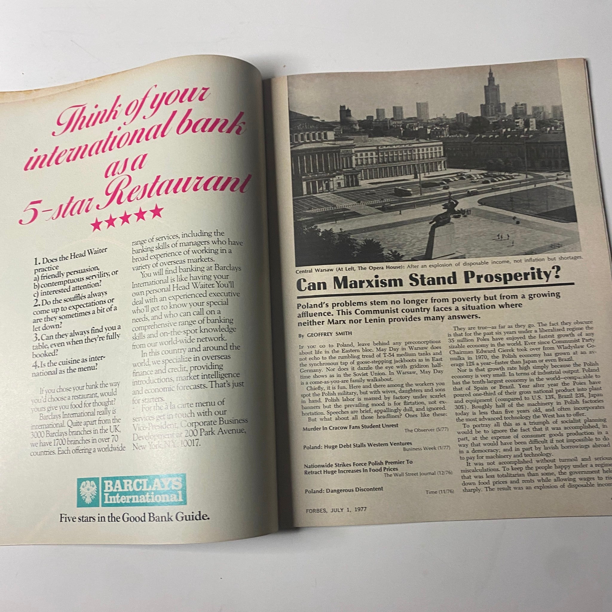 An interior page from Forbes Magazine, July 1, 1977, discussing perspectives on banking and a feature titled 'Can Marxism Stand Prosperity?'. The layout includes a photograph of Central Warsaw.
