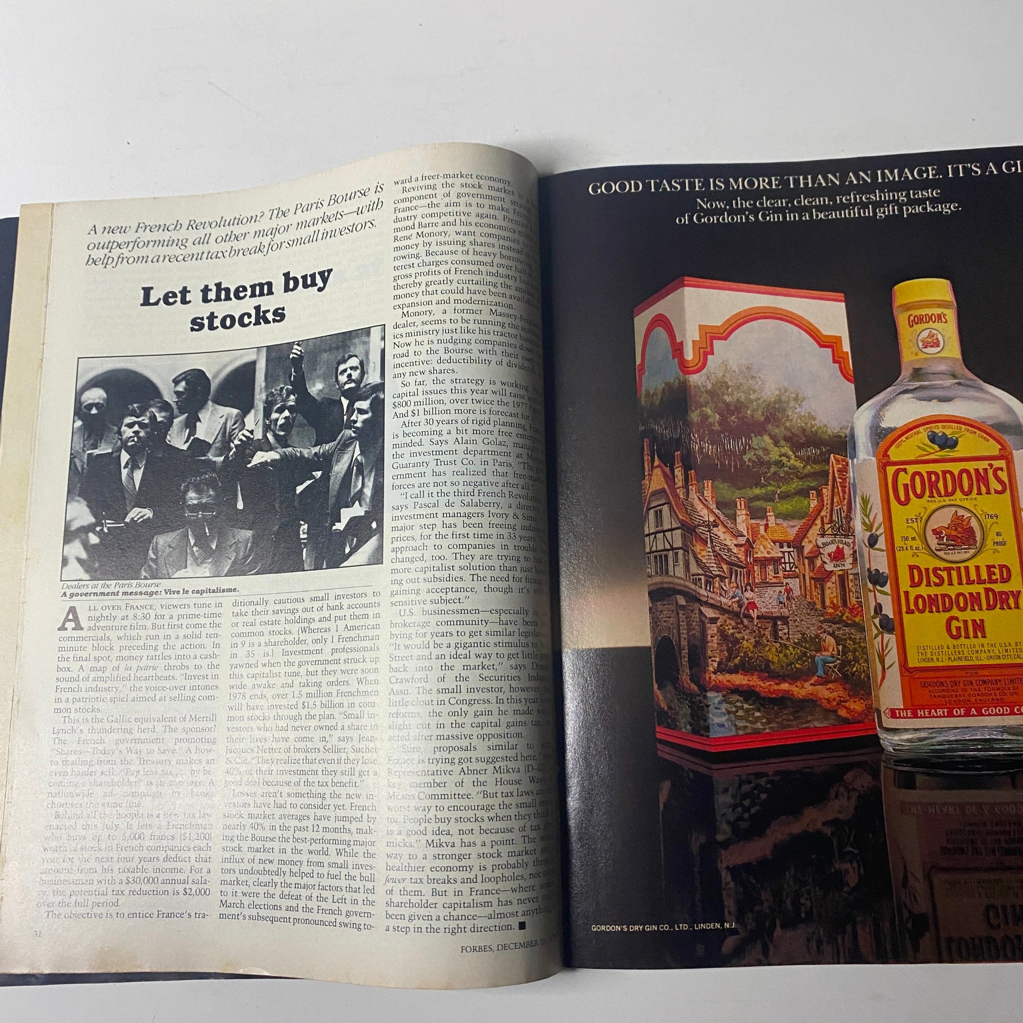 Inside page of Forbes Magazine December 25, 1978 featuring an article titled 'Let them buy stocks' discussing French markets, alongside an advertisement for Gordon's Distilled London Dry Gin.