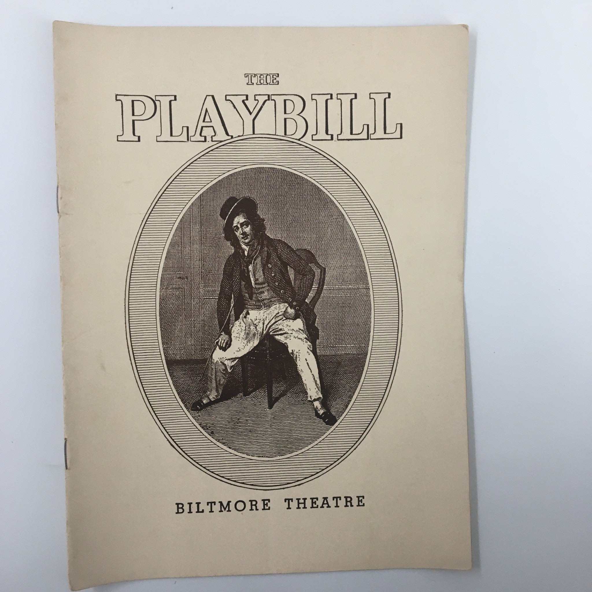 1939 Playbill for 'The Woman Brown', A New Play by Dorothy Cumming at Biltmore Theatre, featuring an illustration of a seated actor in vintage style.
