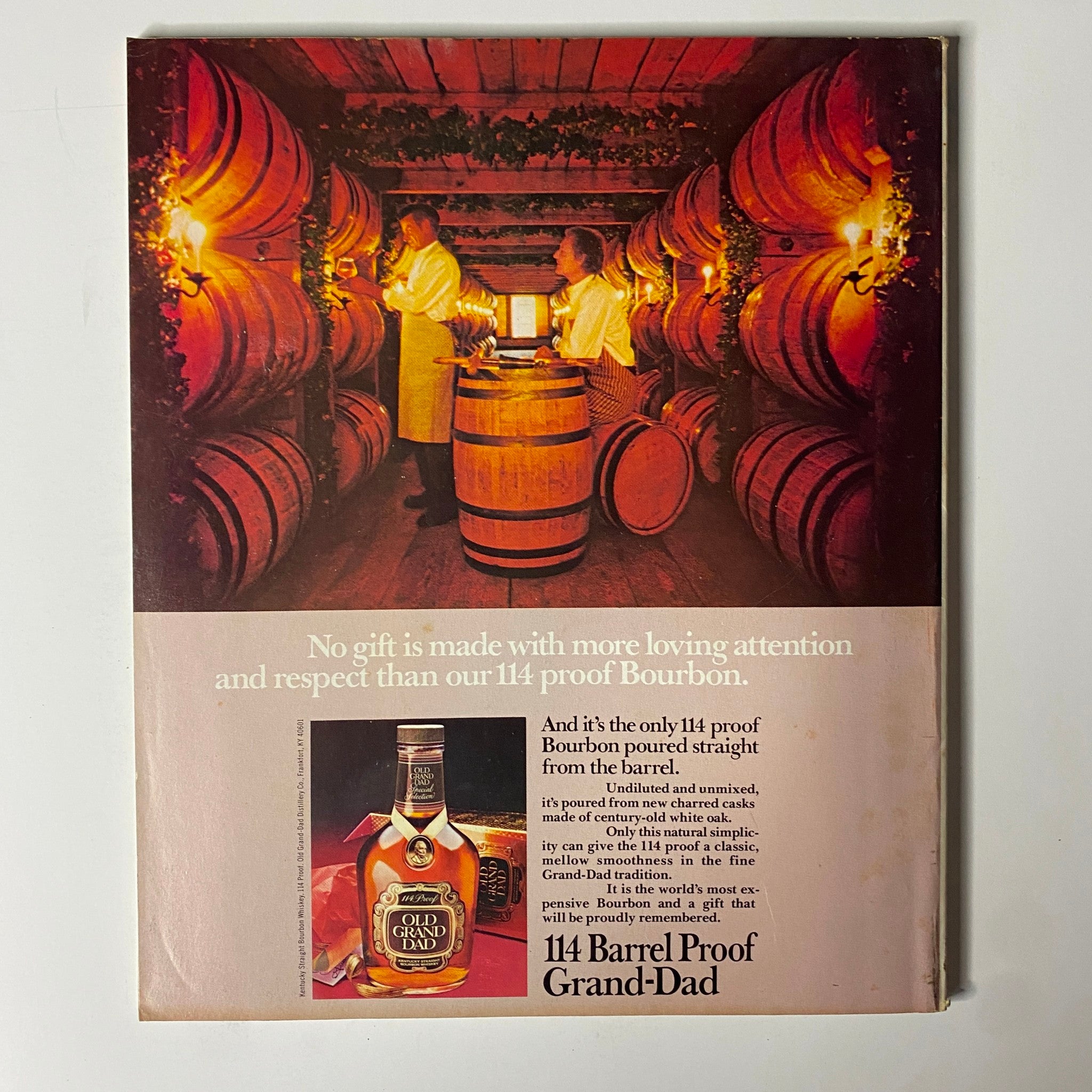 Back cover of Fortune Magazine December 13, 1982 featuring an advertisement for Old Grand-Dad Bourbon, showcasing barrels and distillers in a vintage setting.