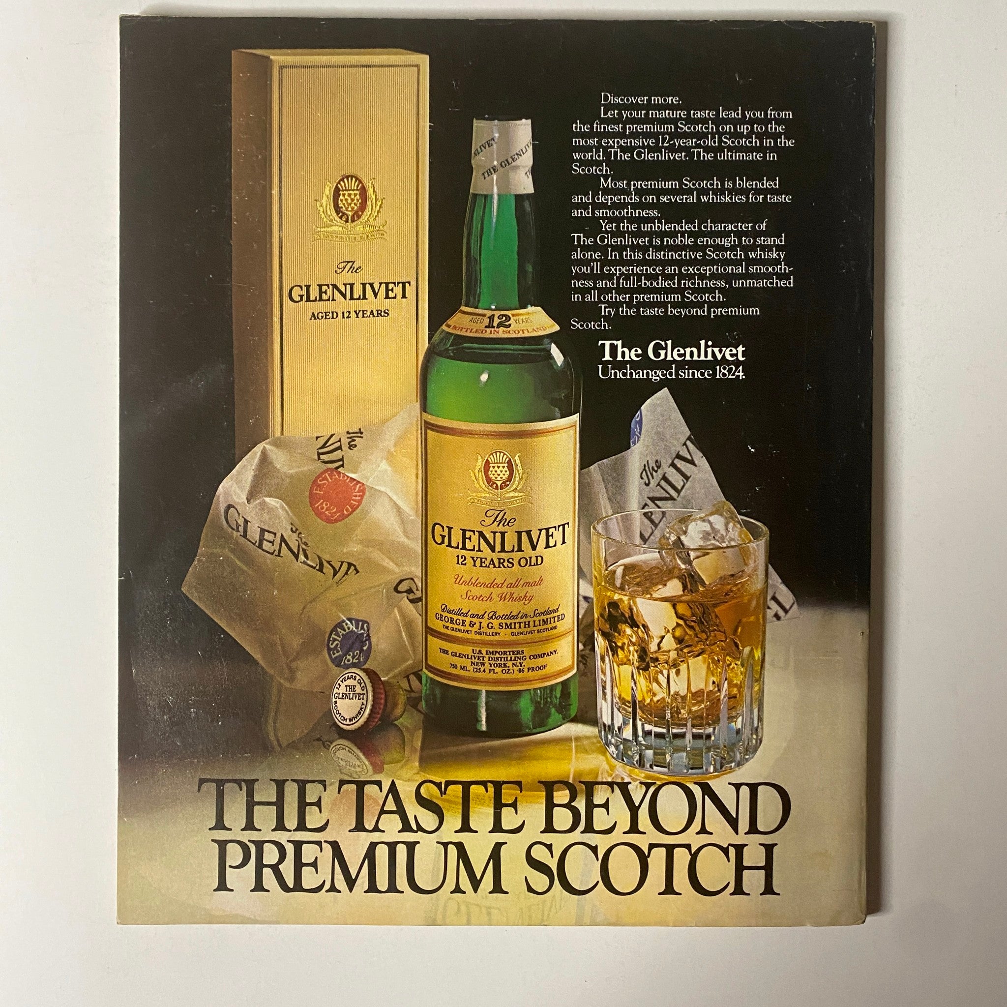 Advertisement for The Glenlivet 12-Year-Old Scotch, showcasing a bottle and glass of Scotch, with the tagline 'The Taste Beyond Premium Scotch,' emphasizing its premium quality and smooth finish.
