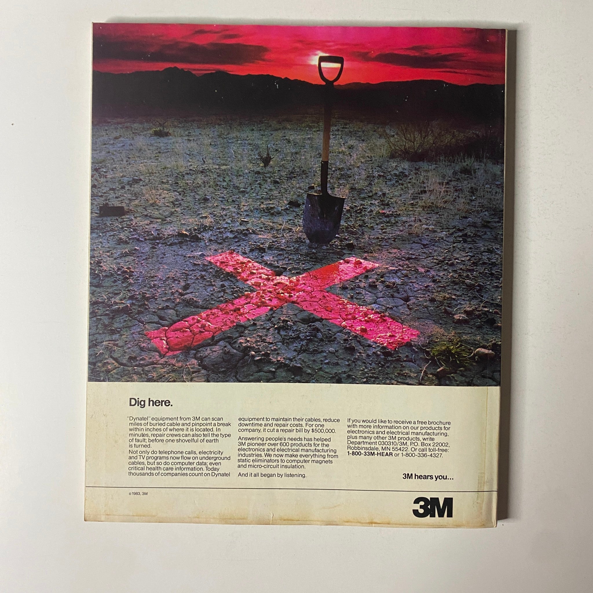 Back cover of Fortune Magazine from October 3, 1983, featuring an advertisement by 3M with the tagline 'Dig here,' showcasing a shovel on cracked earth with a red 'X' marking the spot, emphasizing the importance of underground utility detection.