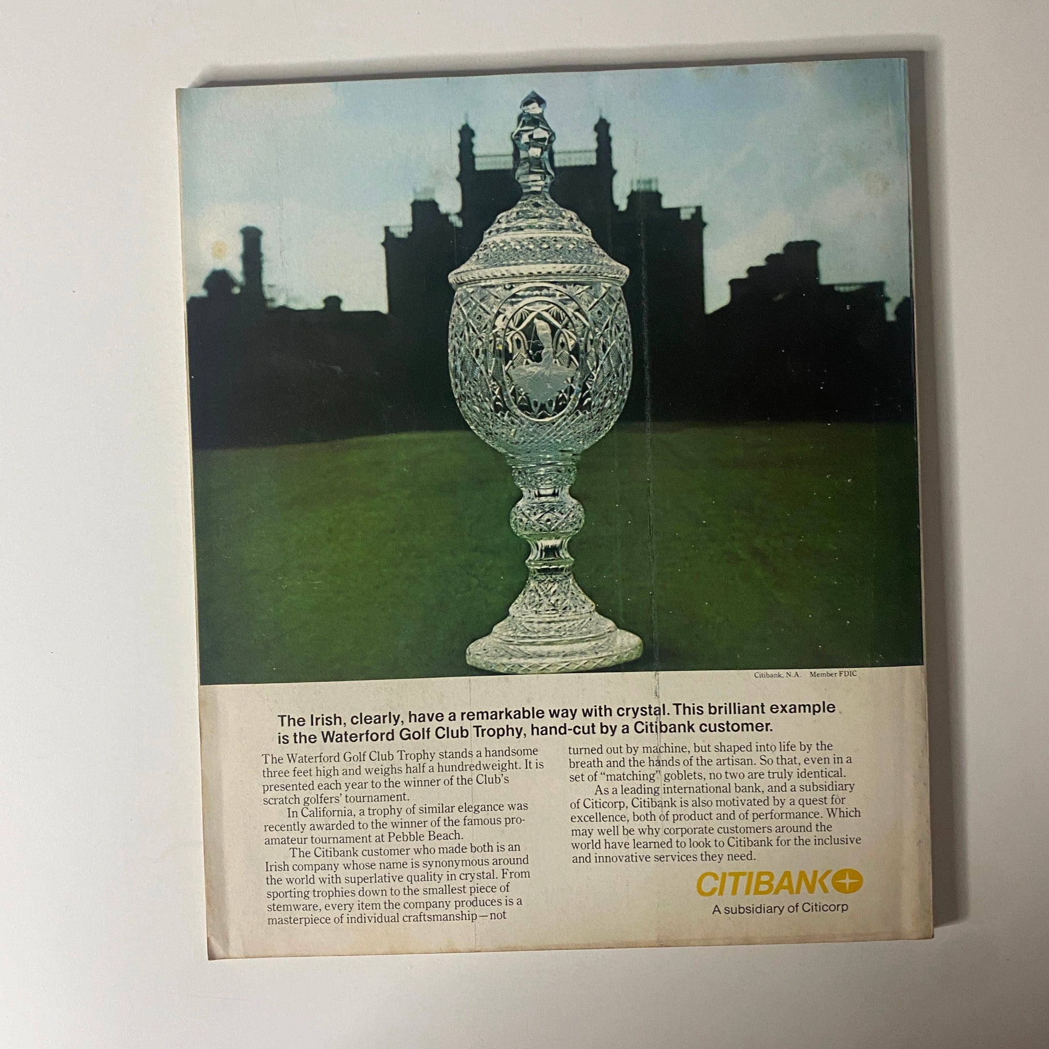 Back cover of Fortune Magazine December 1977 showcasing the Waterford Golf Club Trophy, highlighting the craftsmanship of crystal and the influence of Citibank in the business world, aligned with the magazine's theme on the theme park business.