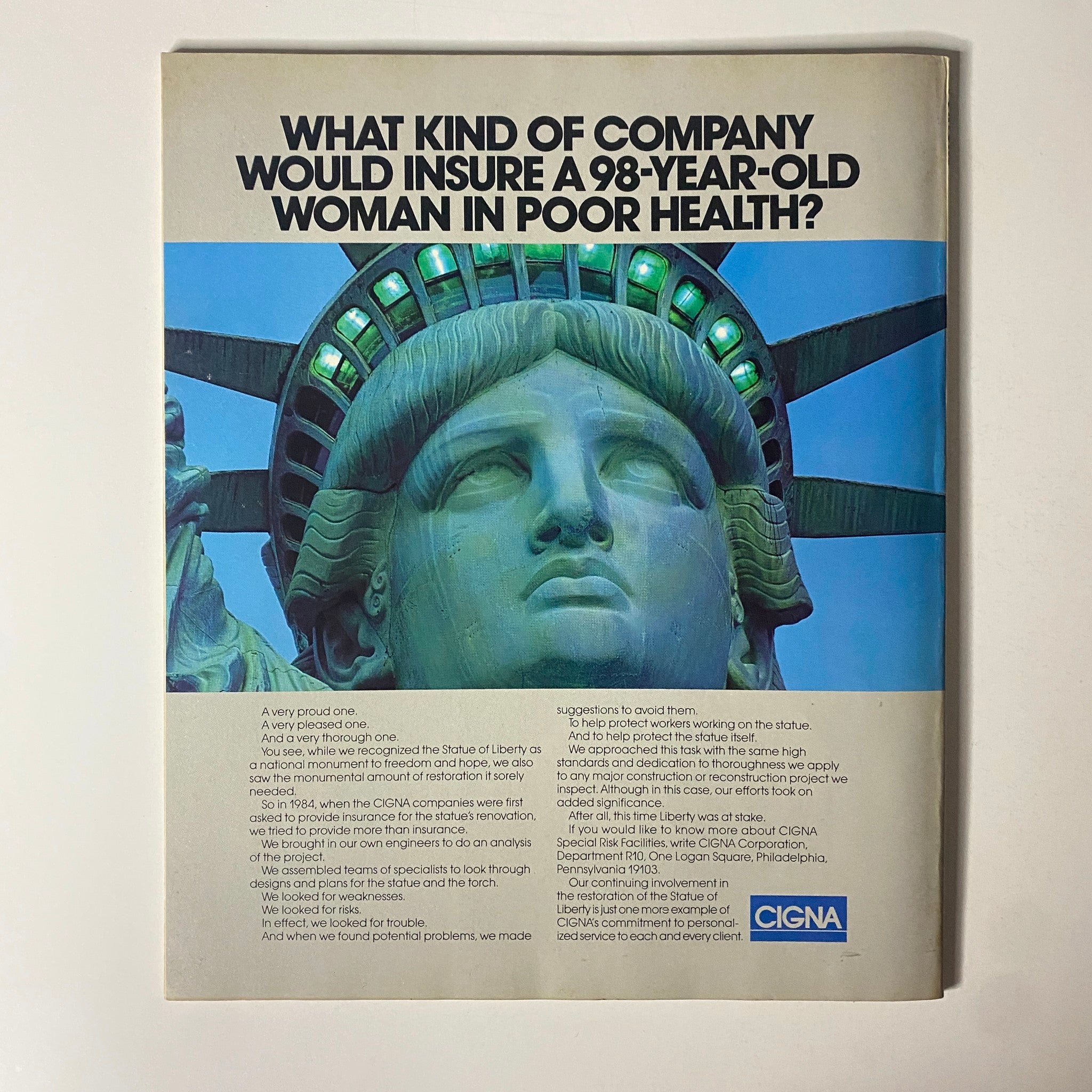 Fortune Magazine September 1, 1986 includes a CIGNA advertisement depicting the Statue of Liberty, posing the question, 'What kind of company would insure a 98-year-old woman in poor health?' highlighting their commitment to risk management.
