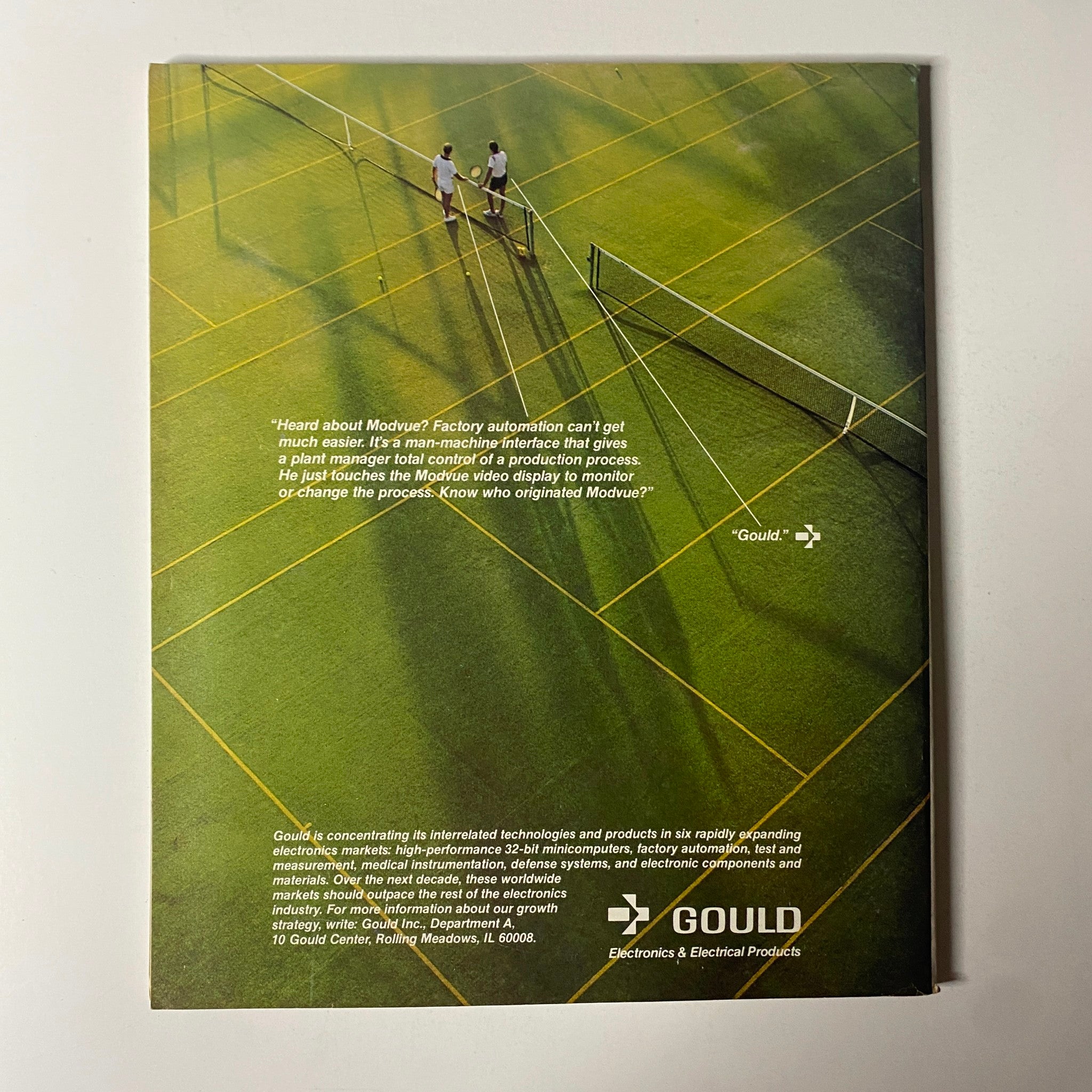 Back cover of Fortune Magazine, April 4, 1983, featuring an advertisement for Gould Electronics. The ad emphasizes factory automation and a man-machine interface for enhanced production control.