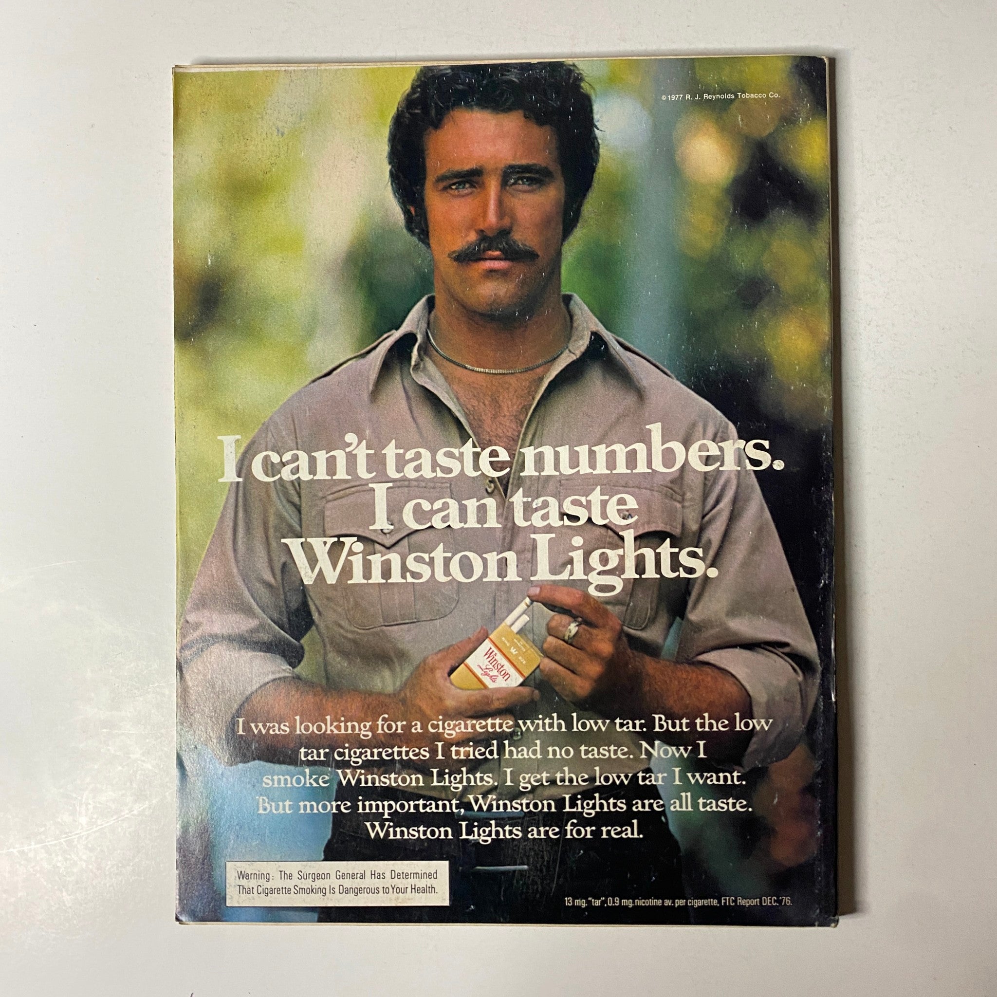 Back cover of Esquire Magazine July 1977 featuring a Winston Lights advertisement with a man stating, 'I can’t taste numbers. I can taste Winston Lights.'