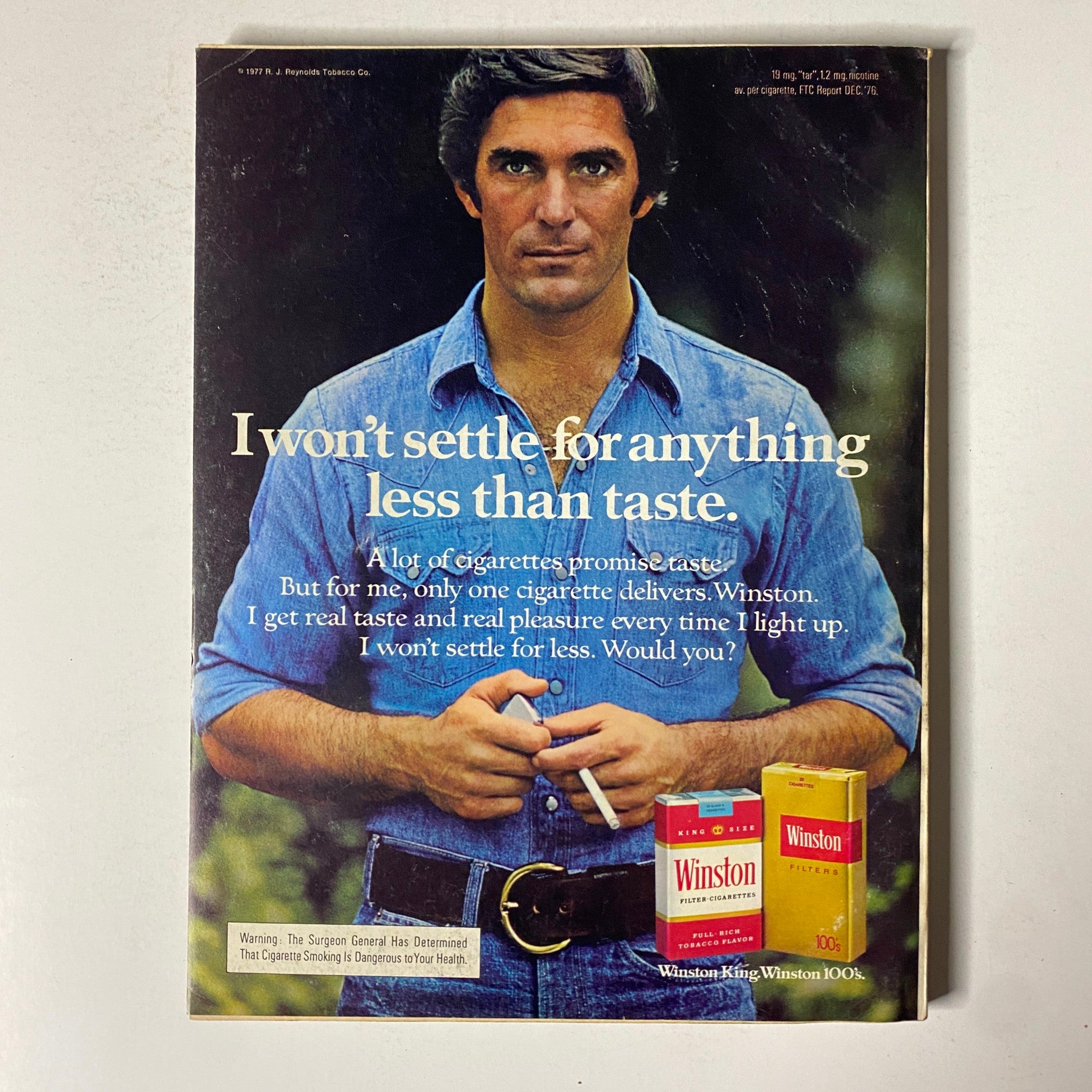 Back cover of Esquire Magazine November 1977, featuring an advertisement for Winston cigarettes with a man promoting brand satisfaction.