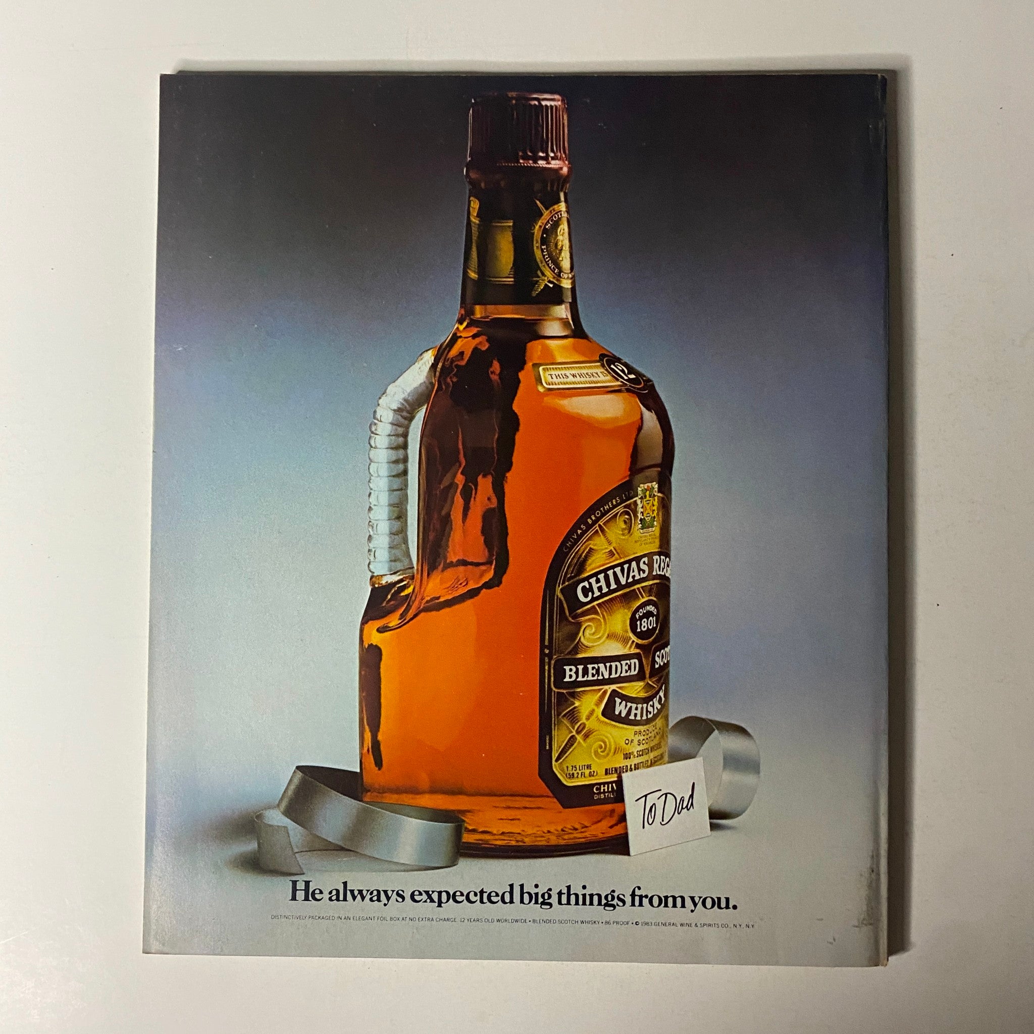 Fortune Magazine June 27, 1983 back cover advertisement for Chivas Regal whiskey, featuring a bottle and a message 'He always expected big things from you.'