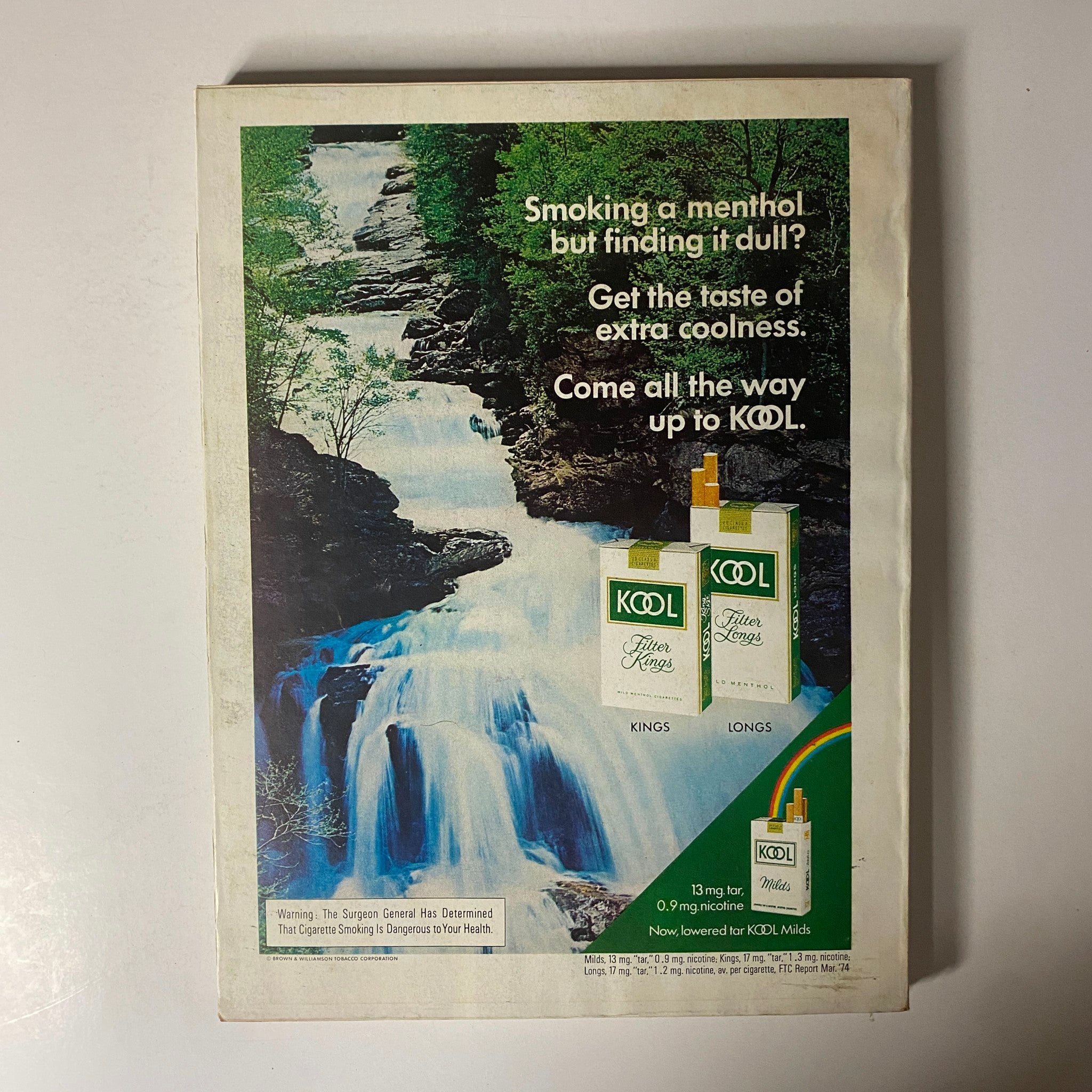 Back cover of Esquire Magazine October 1974 featuring an advertisement for Kool menthol cigarettes, promoting the taste of extra coolness, from the Super Sports Issue.