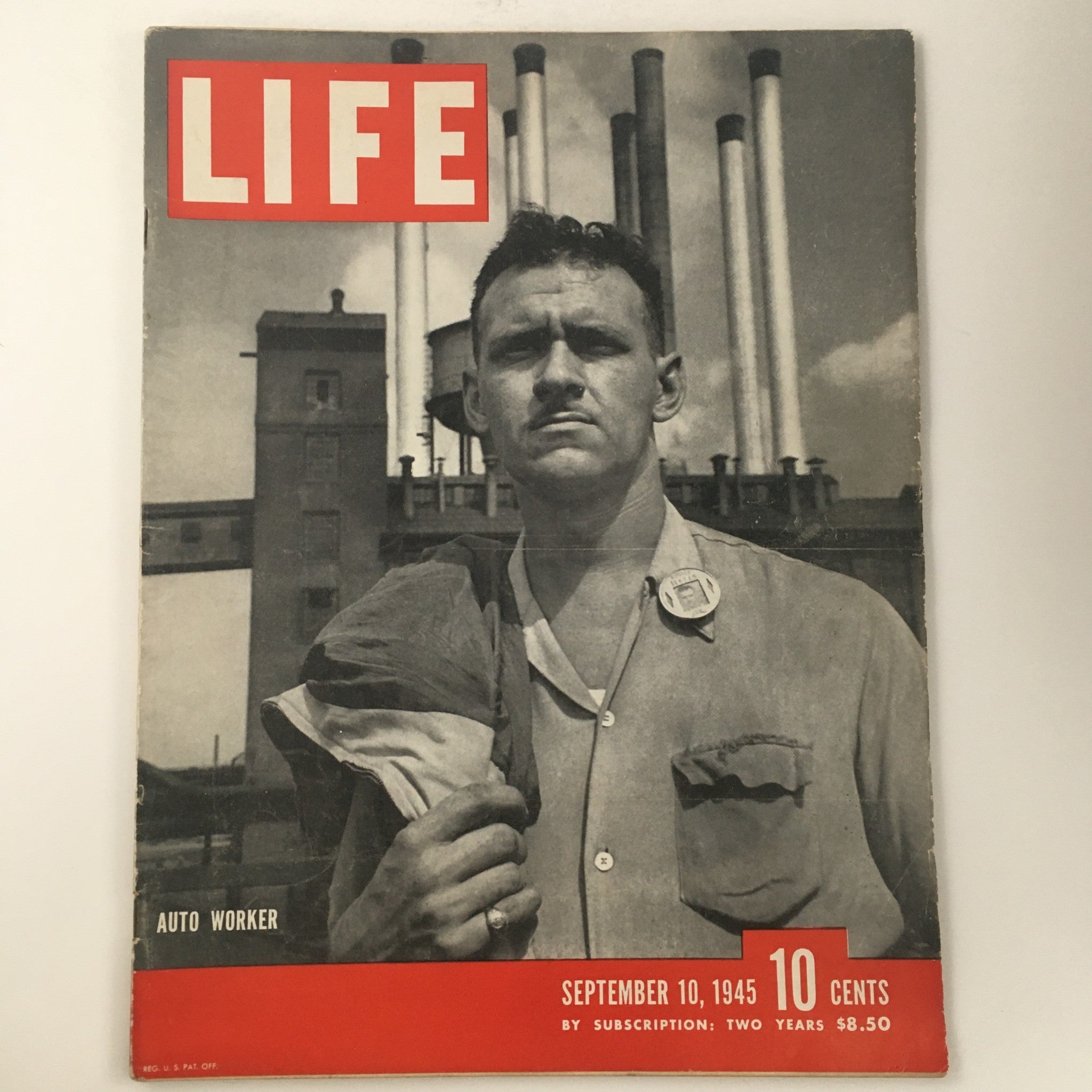 Life Magazine September 10 1945 cover featuring a photograph of an auto worker standing in front of industrial buildings and smoke stacks, representing post-World War II America.