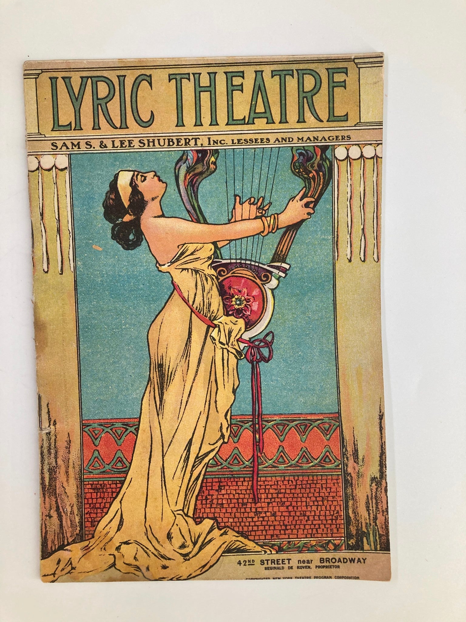 Cover of the 1921 Lyric Theatre program featuring Nora Bayes in Her Family Tree by Hassard Short, depicting a woman in a gown playing a harp.