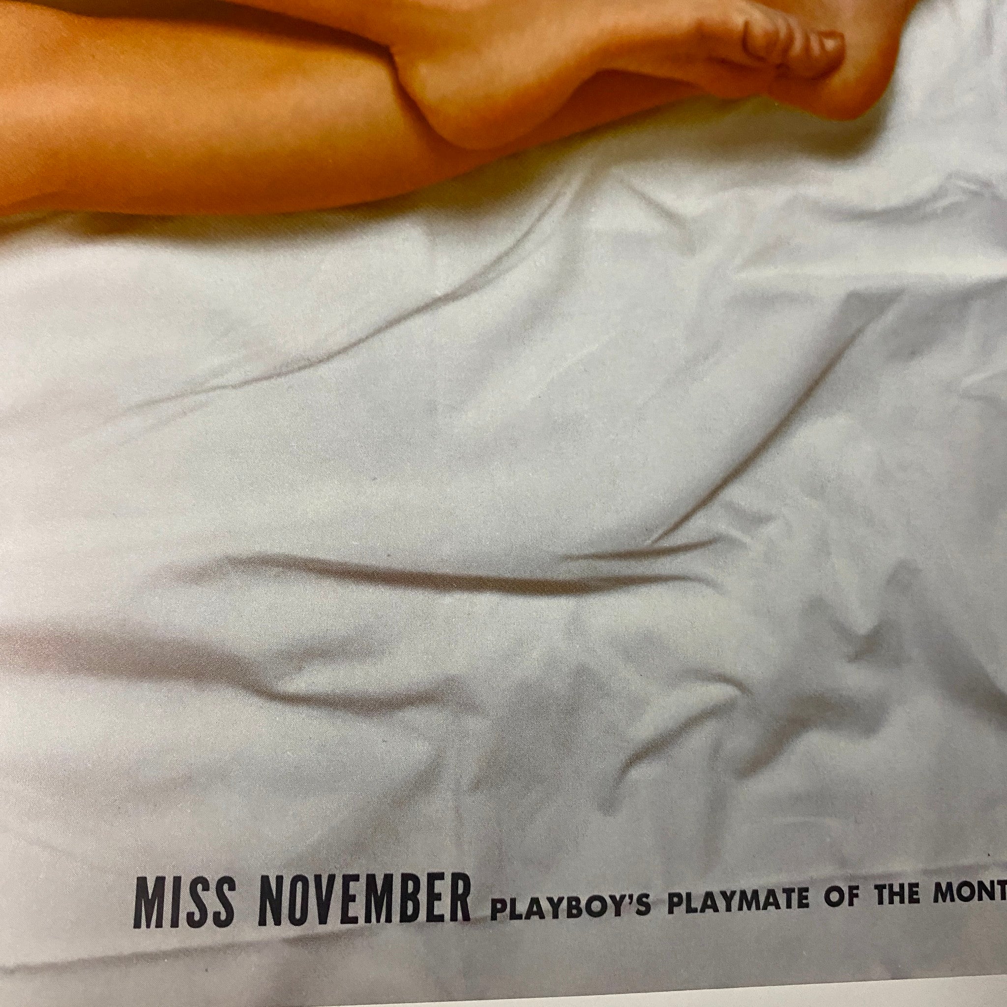 Close-up of the centerfold page from Playboy Magazine November 1964, showcasing Miss November, Kai Brendlinger, emphasizing her recognition as Playboy's Playmate of the Month.