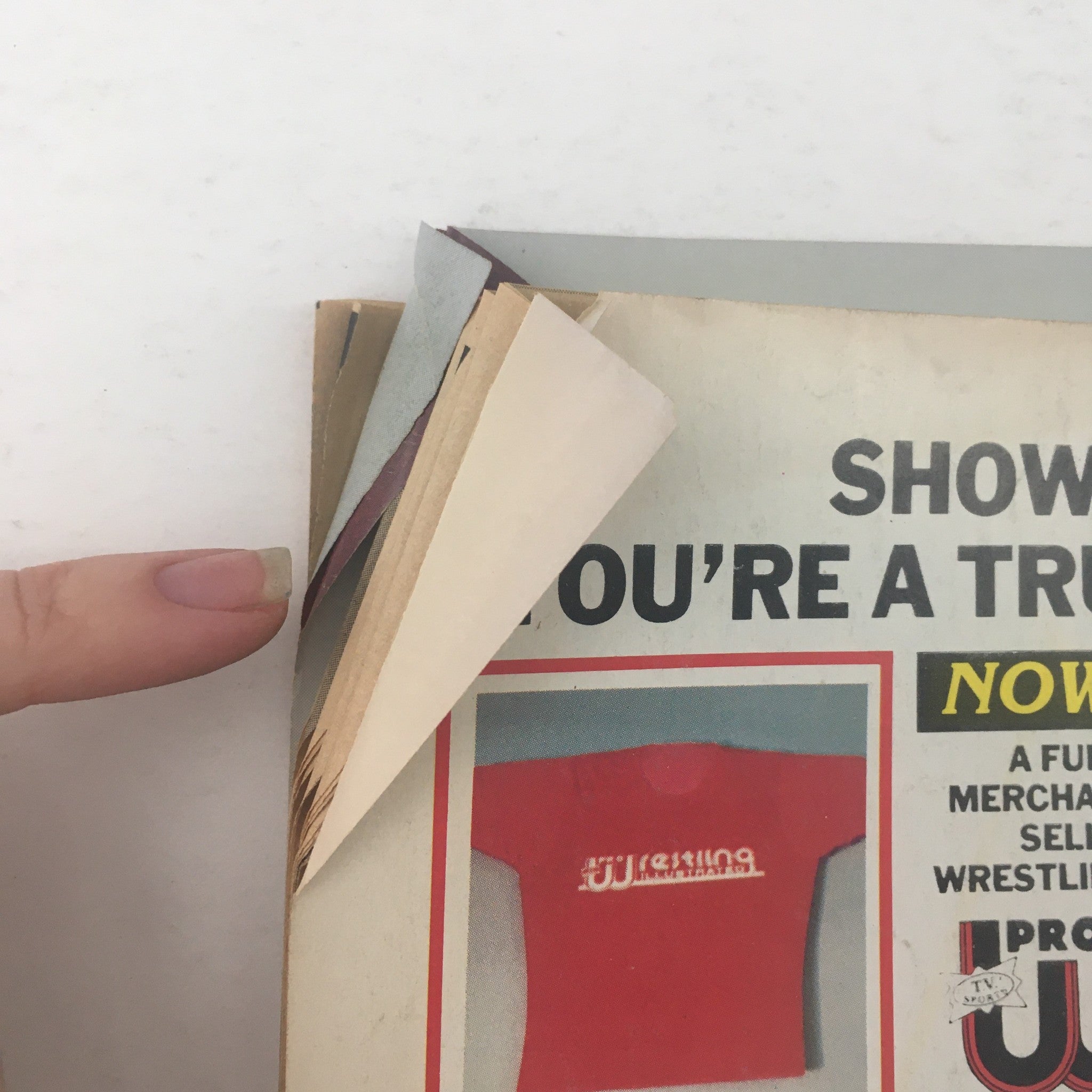 Pro Wrestling Illustrated Magazine July 1985, showing a close-up of the magazine's back cover with a folded corner, highlighting slight wear and age.