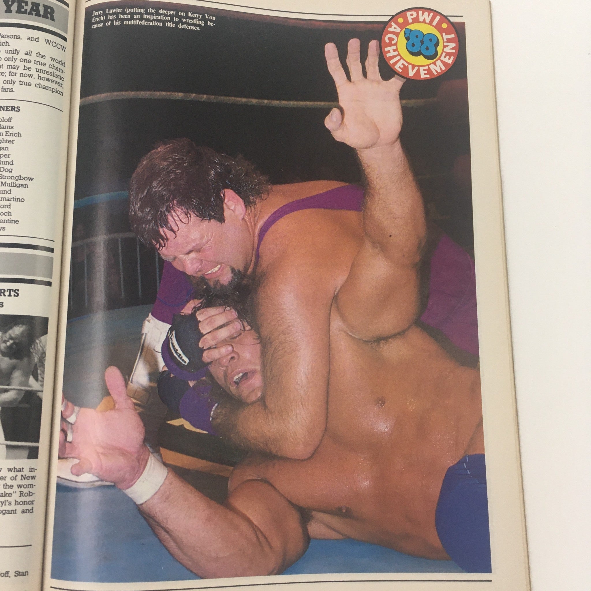 Action shot from Pro Wrestling Illustrated March 1989 of Jerry Lawler using a sleeper hold on Kerry Von Erich, showcasing wrestling techniques.