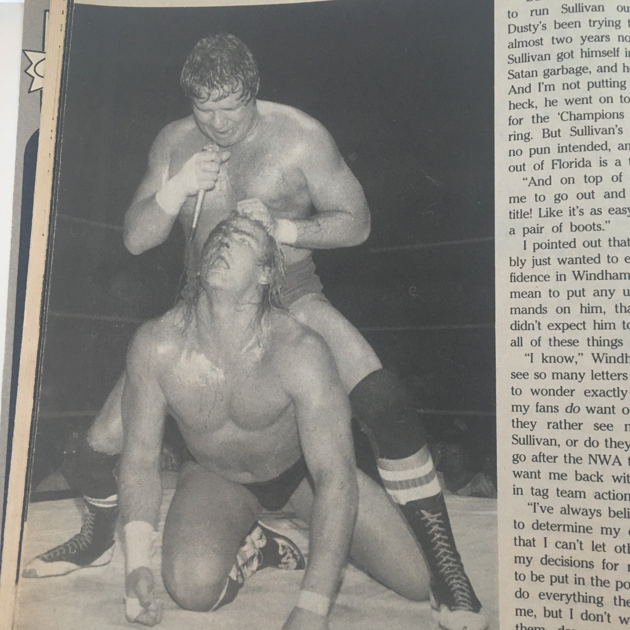 Pro Wrestling Illustrated December 1984 Barry Windham & Kerry Von Erich No Label - Intense scene from a wrestling match, showcasing grappling techniques between competitors.