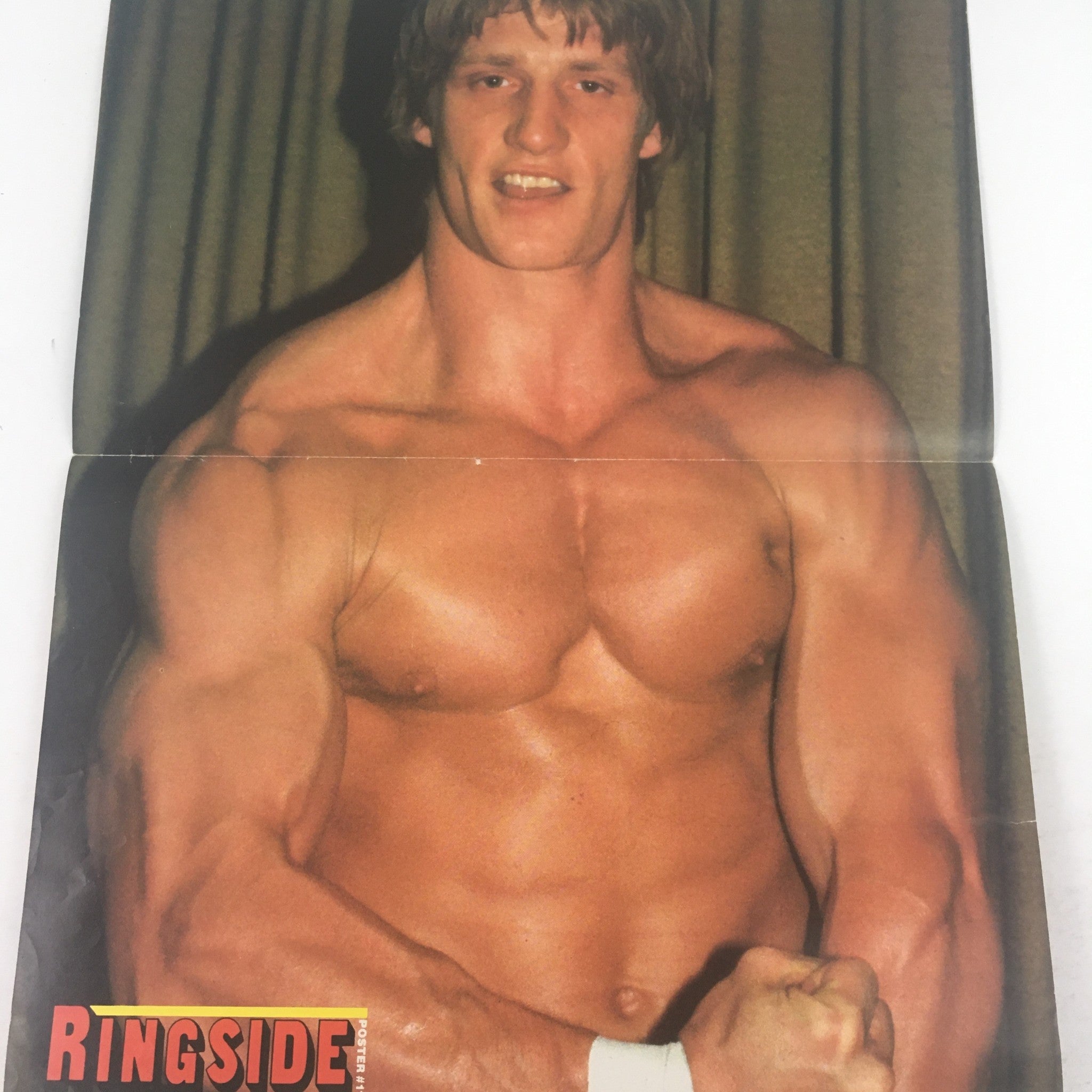 Wrestling Scene's Ringside January 1985 magazine interior photo showcasing a muscular wrestlers' pose.