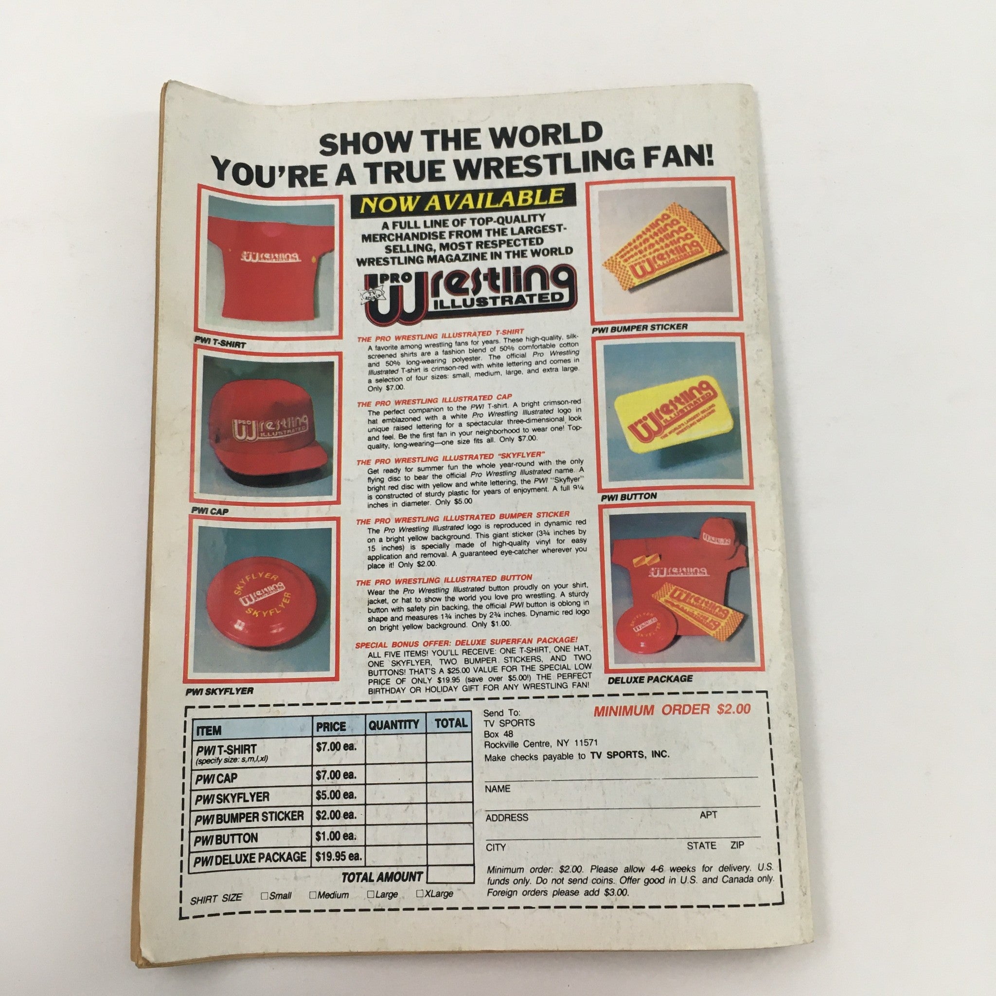 Back cover of Pro Wrestling Illustrated Magazine December 1985 showcasing merchandise offerings including t-shirts, caps, bumper stickers, and buttons for wrestling fans.