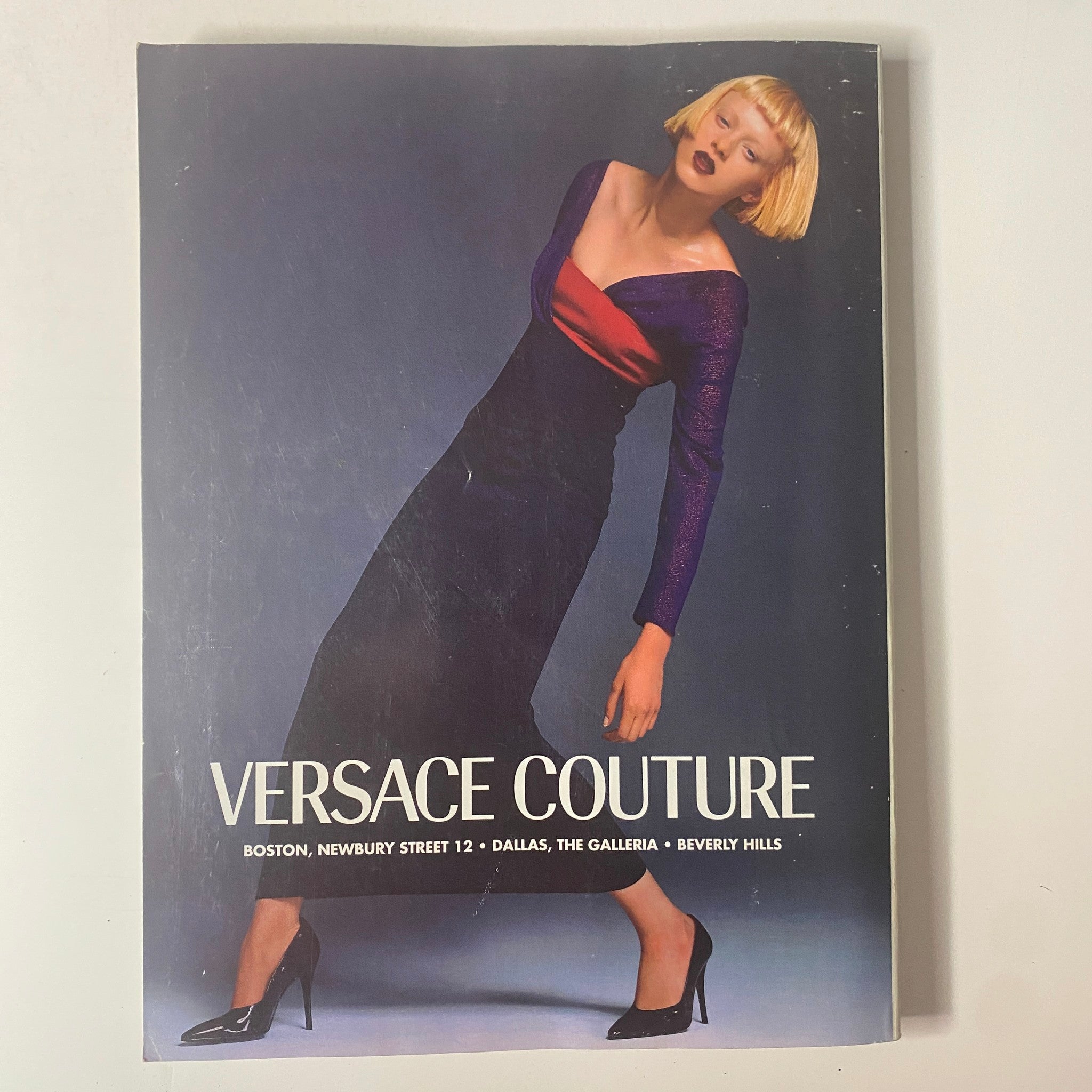Cover of Versace Couture magazine highlighting a model in a striking gown with bold colors. Title: Vogue Magazine November 1997 Stella Tennant Cover No Label.
