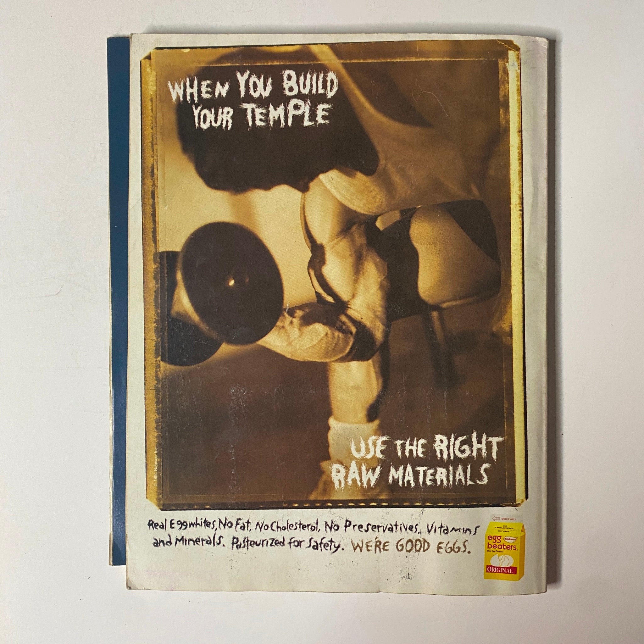 An advertisement page in the Muscle & Fitness and Flex Magazine Spring 1994 showcasing a fitness-related product with the phrase 'When You Build Your Temple Use the Right Raw Materials', emphasizing healthy nutrition.