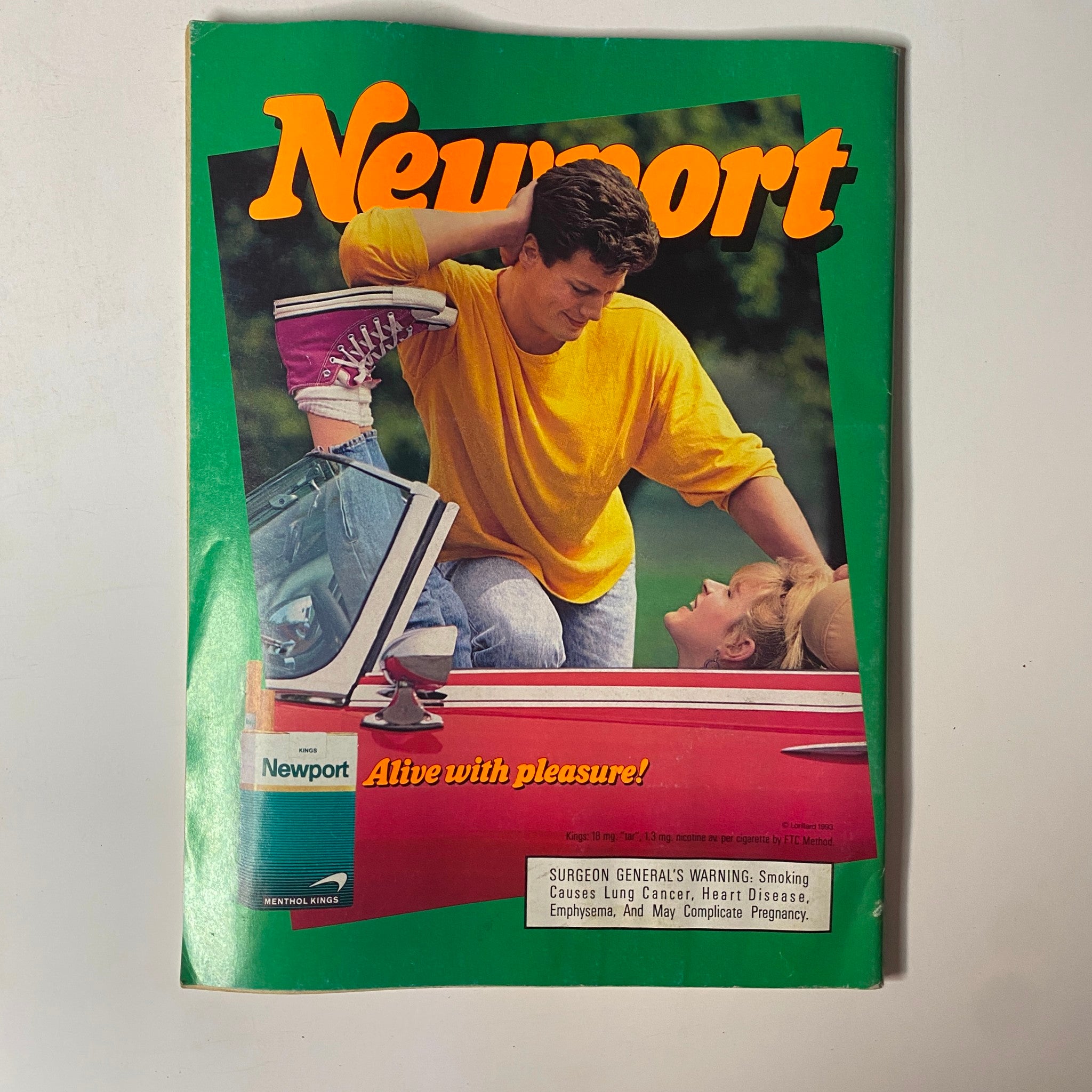 A Newport Cigarettes advertisement from the 1993 Boxing Illustrated Magazine showing a casual moment between a man and a woman, promoting the brand's lifestyle image.