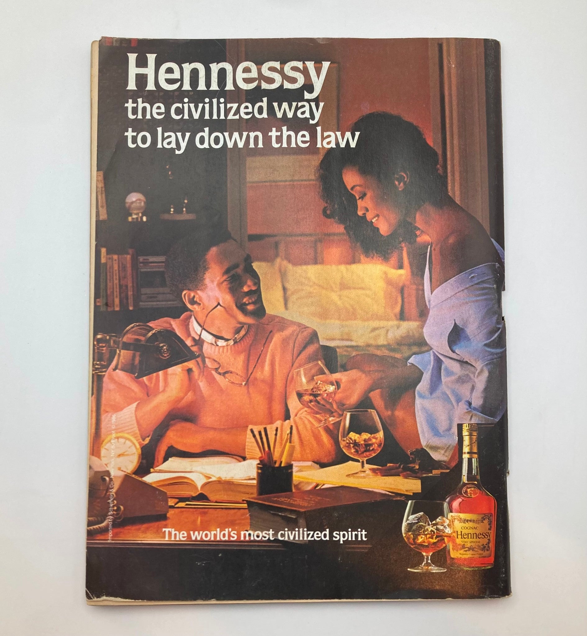 Vintage magazine Hennessy ad featuring a couple, illustrating cultural themes consistent with the era of the 1986 Essence Magazine.