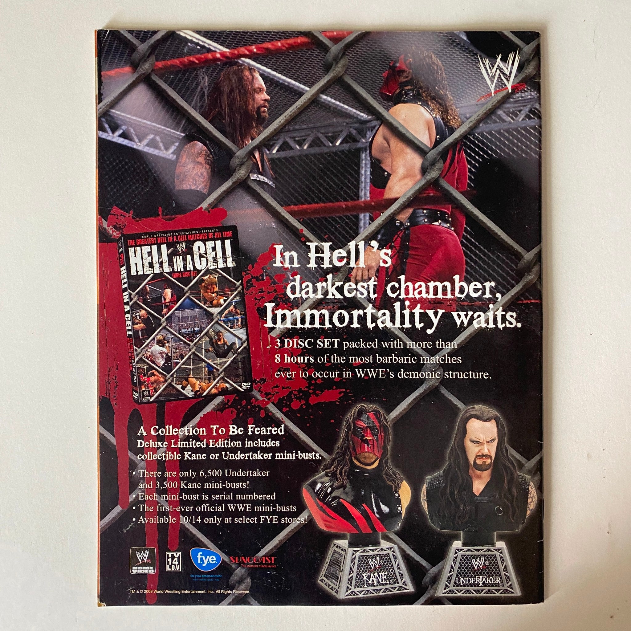 Back cover of WWE's 'Hell in a Cell' 3-disc set, showcasing collectible Kane and Undertaker mini-busts and featuring details about the matches.