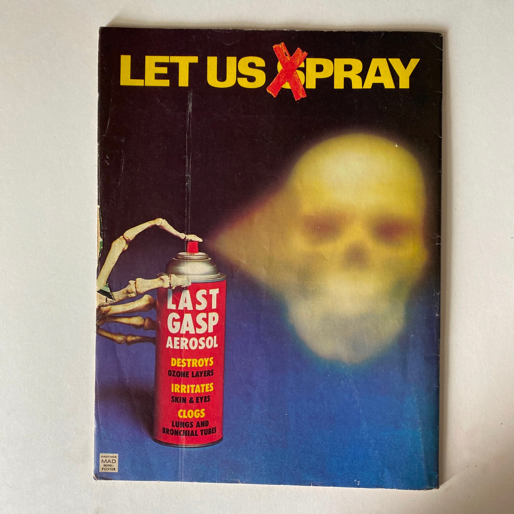 Back cover of Mad Magazine showcasing a humorous advertisement, continuing the magazine's tradition of satirical content. Included is the title 'LET US X PRAY' alongside a striking image.
