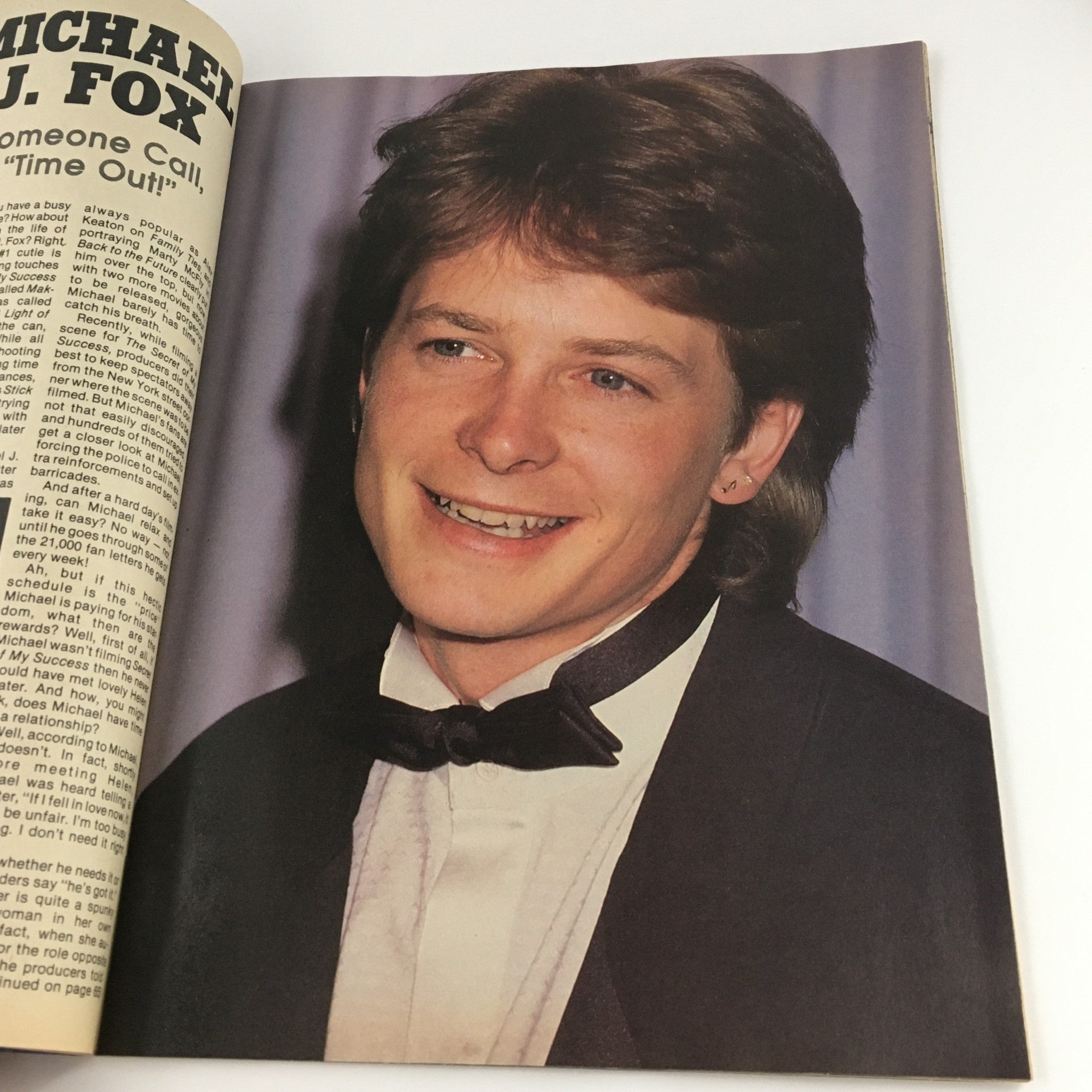 Teen Idols Mania Magazine November 1986 showcasing Michael J. Fox in a tuxedo, reflecting the glamour and style of the 80s entertainment scene.