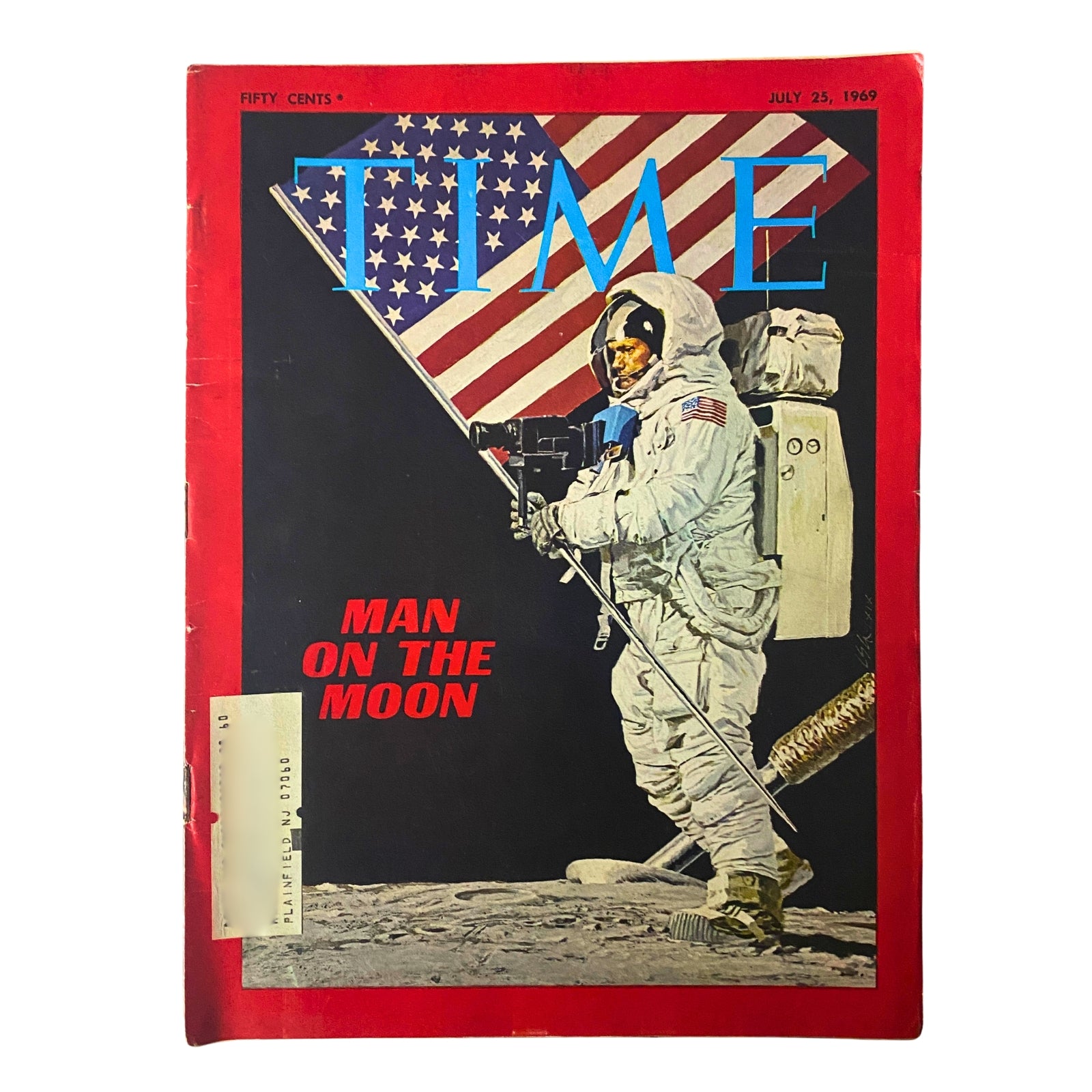 Cover of Time Magazine July 25, 1969, featuring the headline 'Man on The Moon' with an astronaut holding a lunar flag against a backdrop of the American flag.