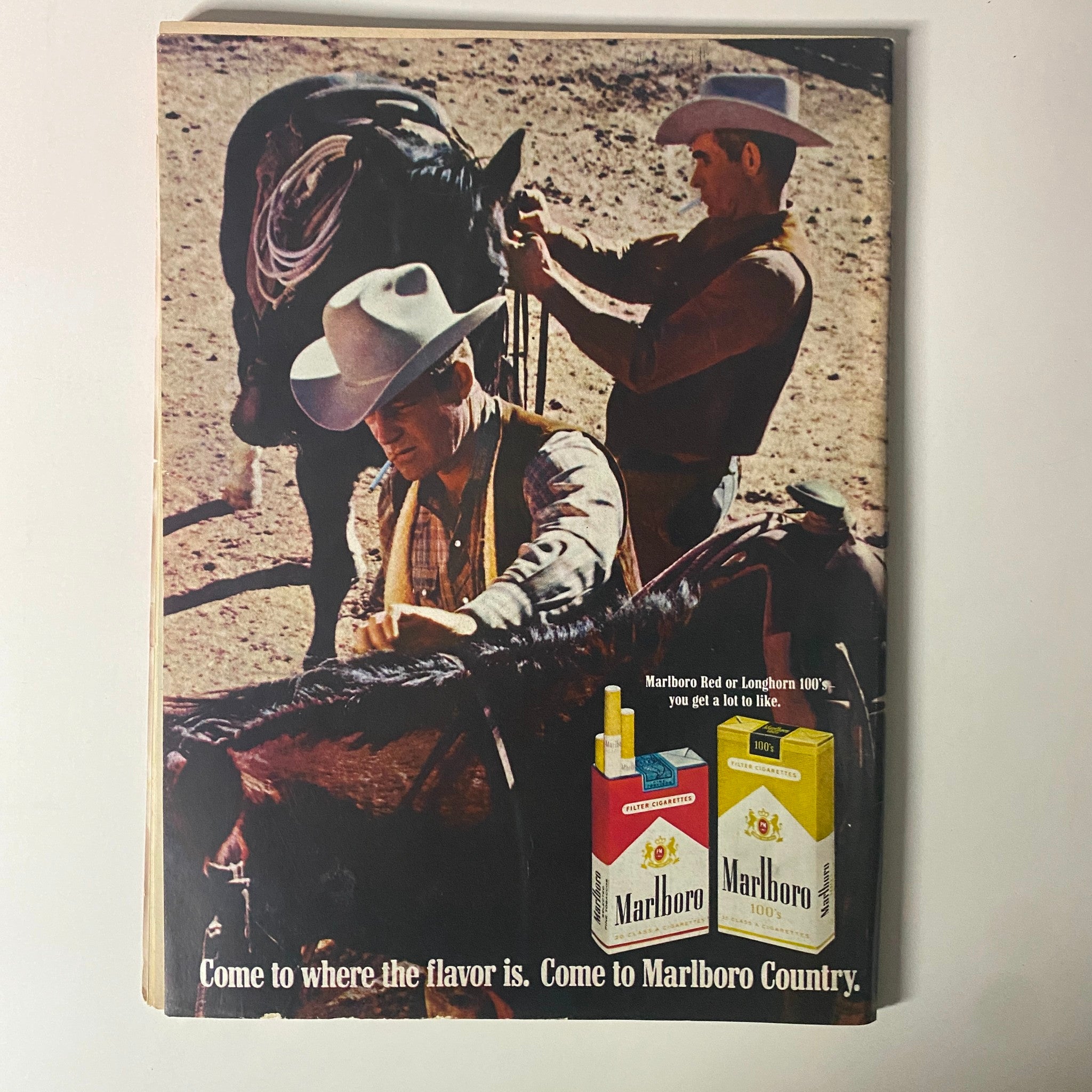 Advertisement page from Time Magazine July 25, 1969, featuring two cowboys on horseback promoting Marlboro cigarettes with the tagline 'Come to where the flavor is. Come to Marlboro Country.'