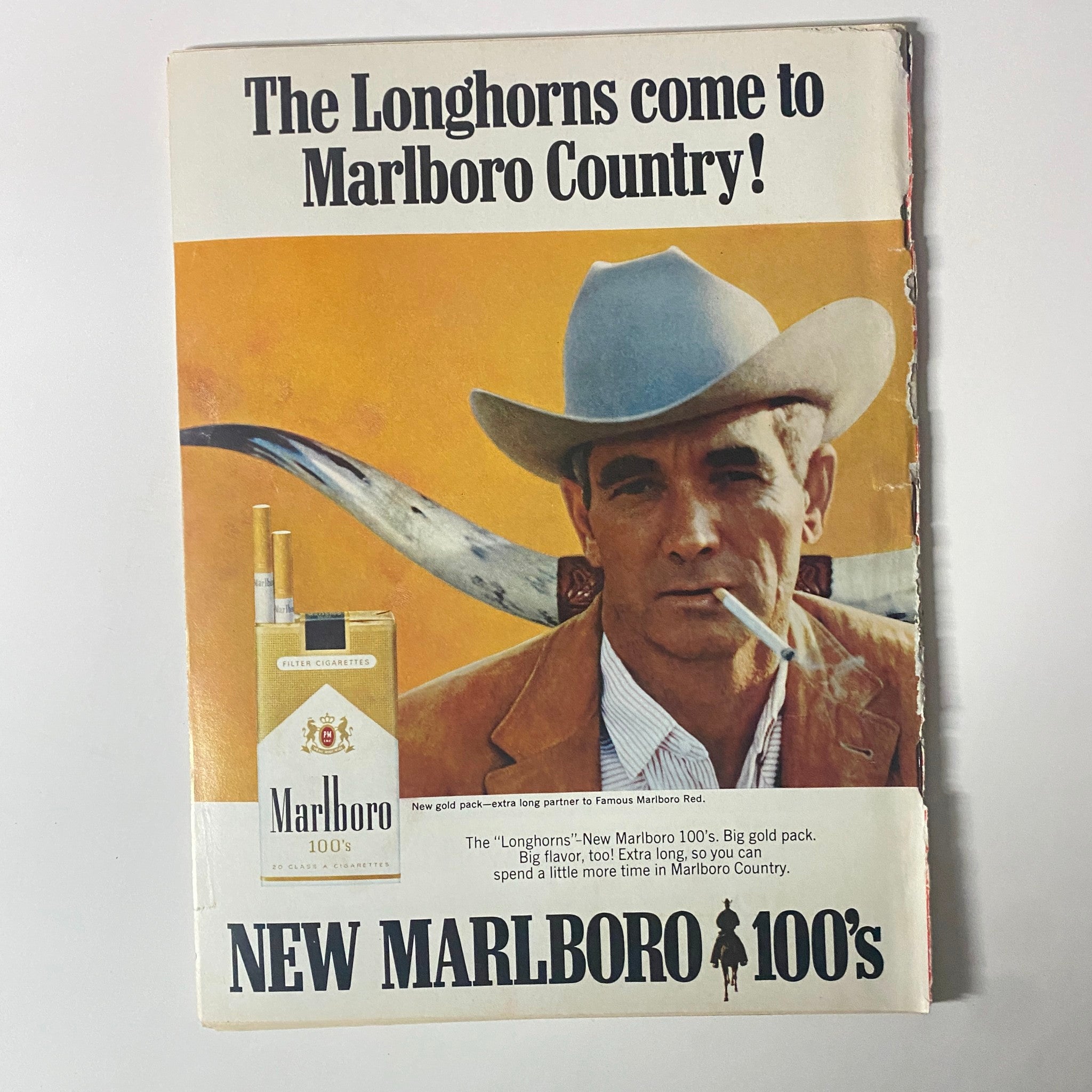 Advertisement page from Time Magazine for New Marlboro 100's, showcasing a cowboy figure promoting the brand, featured in the August 25, 1967 issue.