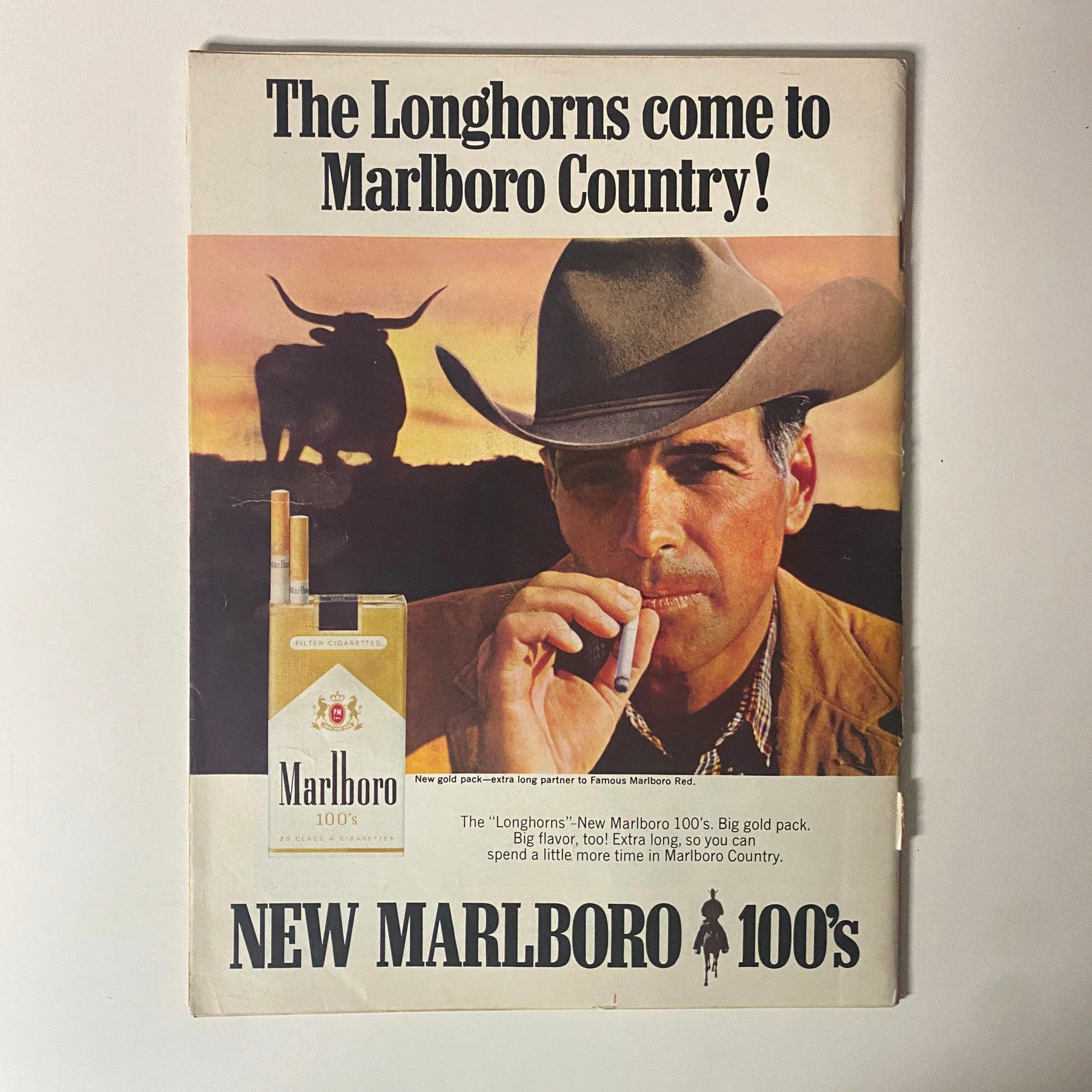 Advertisement for Marlboro 100's featuring a cowboy in Marlboro Country, highlighting the new pack design from Time Magazine September 1, 1967, Vol 90 No. 9.
