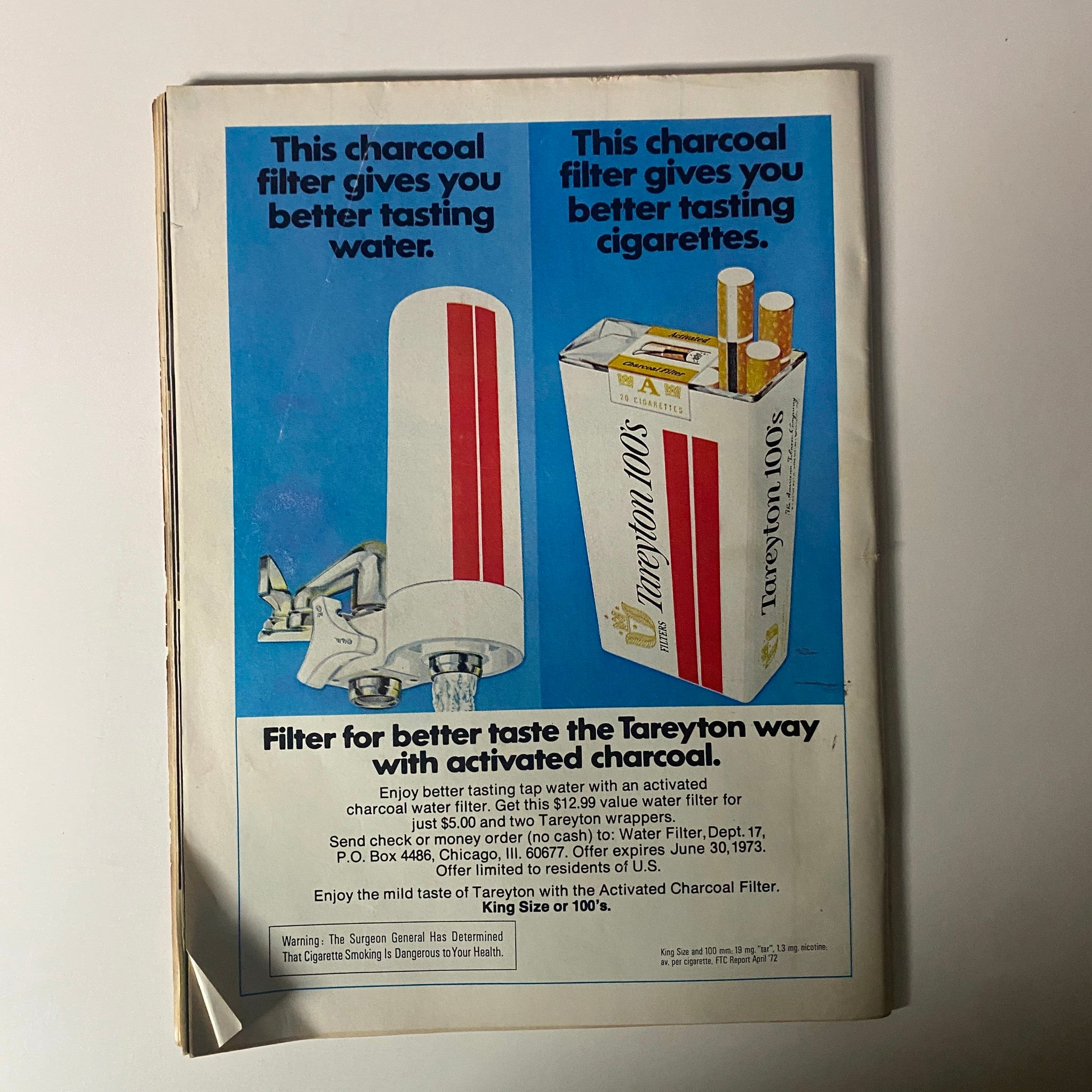 Advertisement page from Time Magazine September 11, 1972 promoting Tareyton cigarettes and a charcoal water filter for better taste, associated with Mark Spitz, an Olympian wave of records.