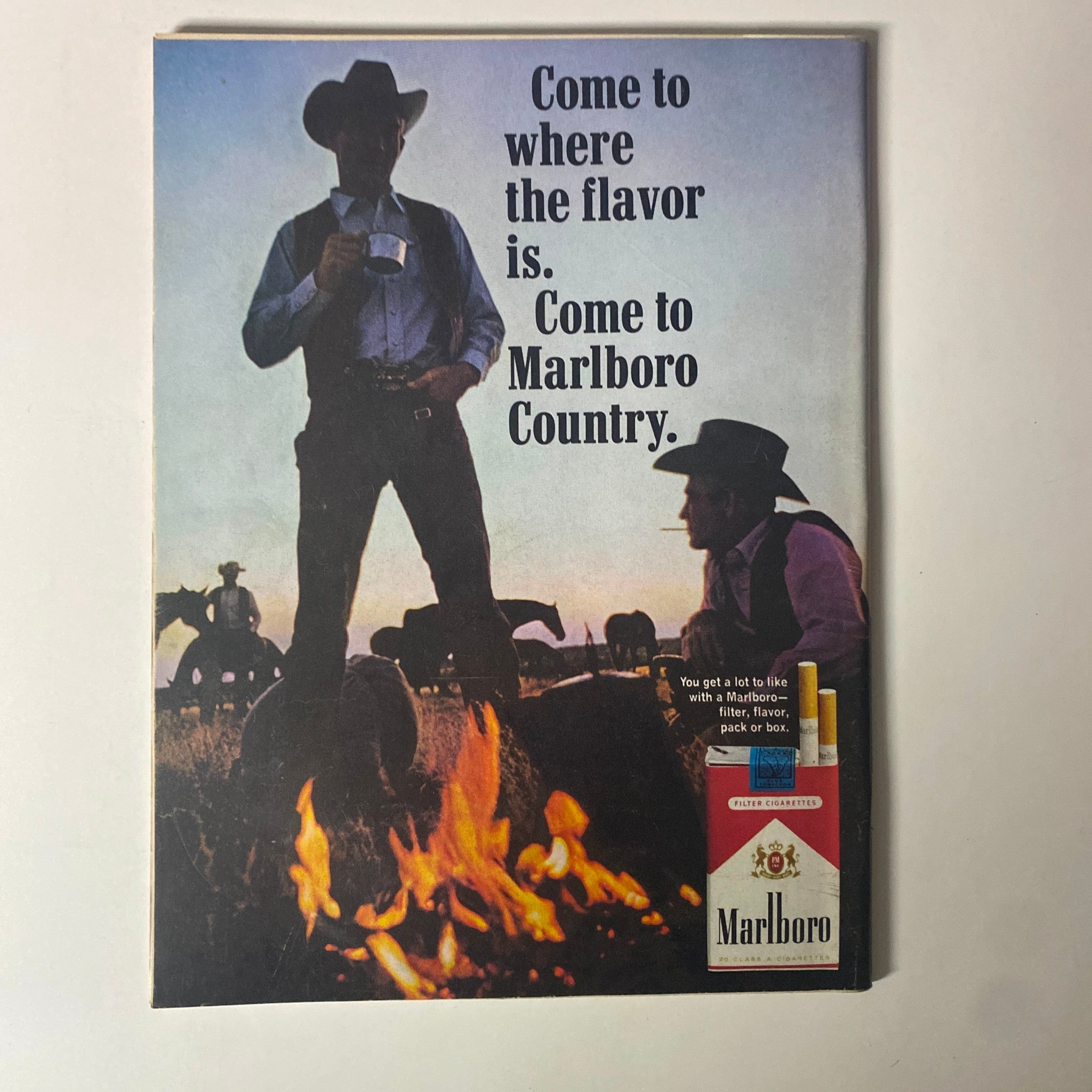 Advertisement page featuring Marlboro cigarettes from Time Magazine March 3, 1967, showcasing a cowboy with a rugged landscape and the slogan 'Come to Marlboro Country'.