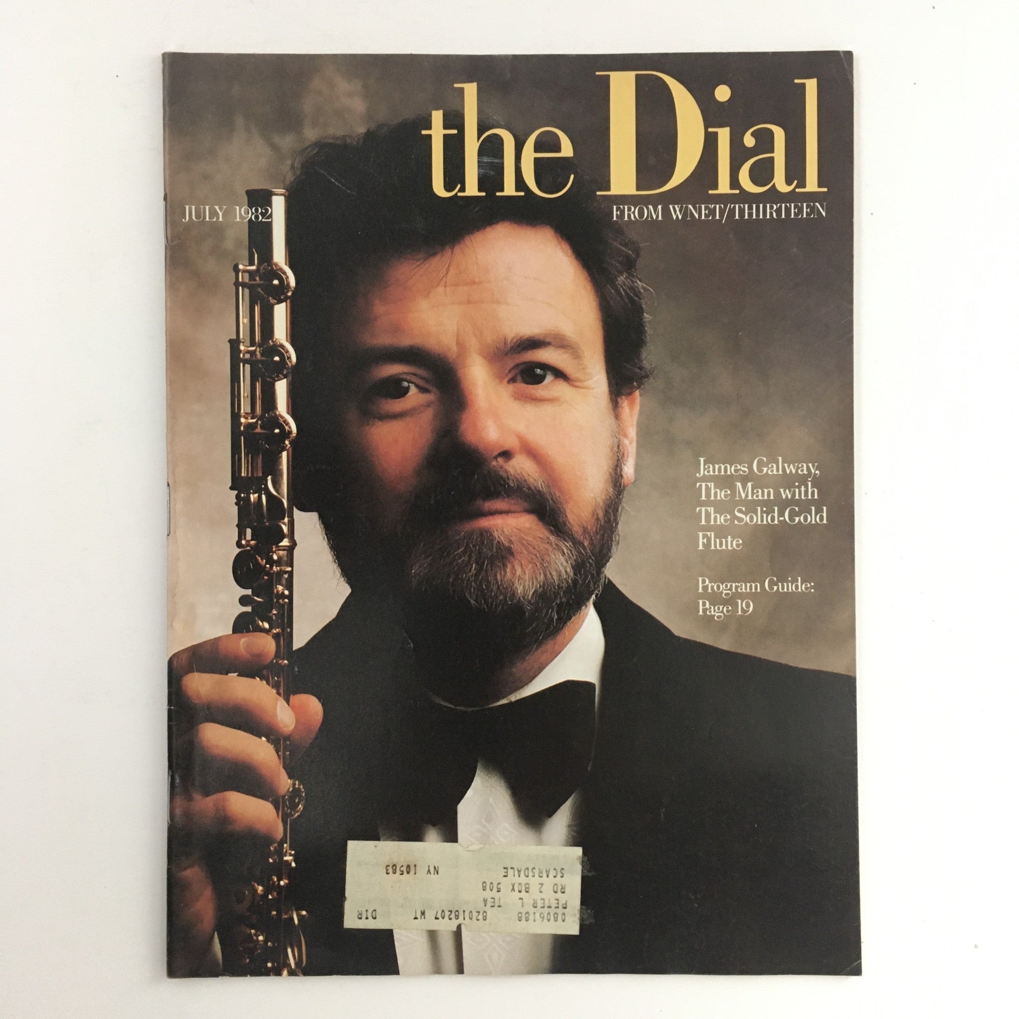 The Dial Magazine from July 1982 featuring James Galway, known as 'The Man with the Solid-Gold Flute'. The cover portrays Galway holding his flute, highlighting his iconic image as a renowned flutist. The magazine showcases insights into his musical artistry and cultural significance, making it a collectible for vintage magazine enthusiasts.
