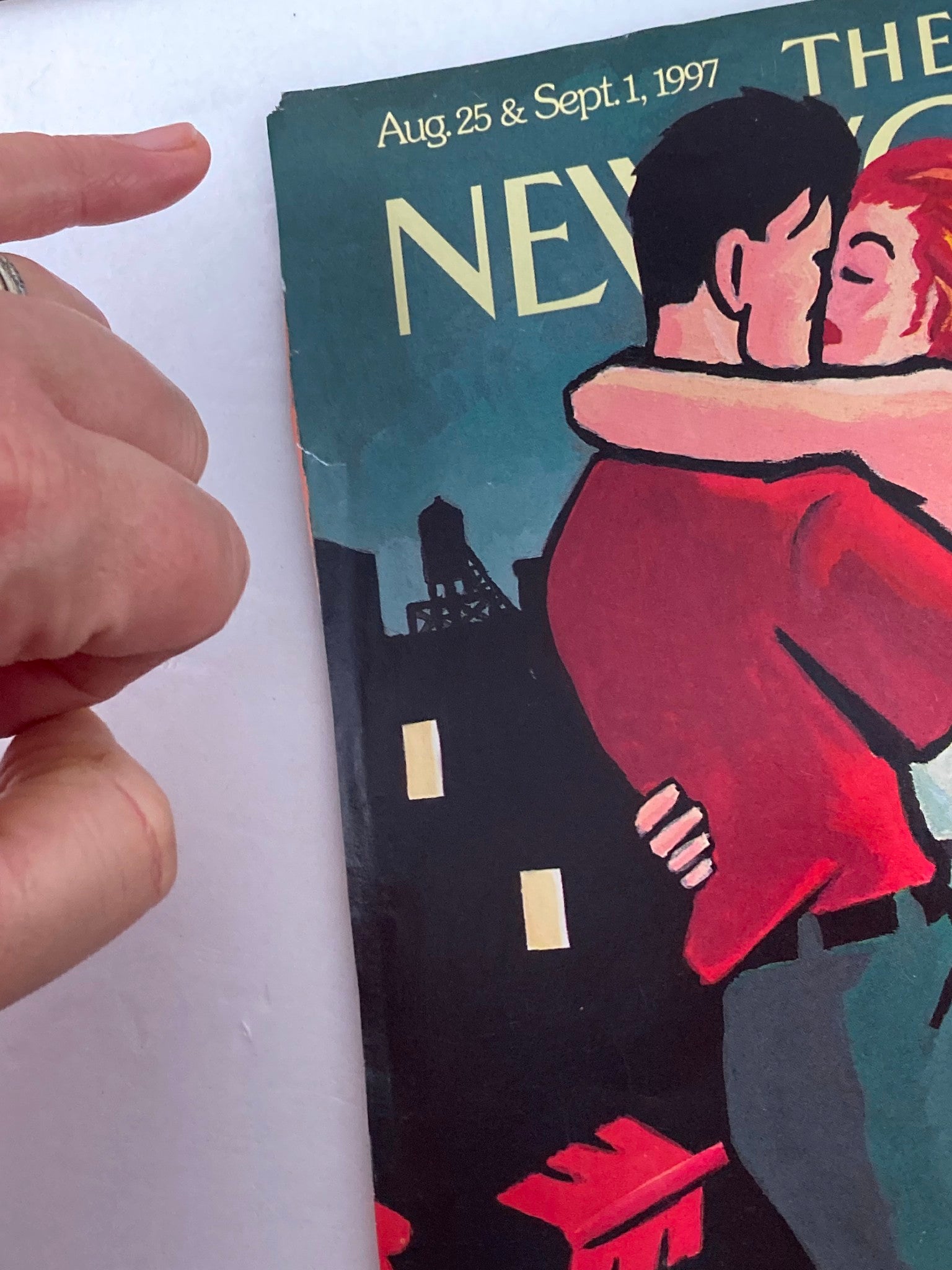 Close-up view of the cover art from The New Yorker, August 25, 1997, featuring 'Beau and Eros' by Art Spiegelman. The image focuses on details of the couple sharing a kiss, highlighting the artistic style and the magazine's title.