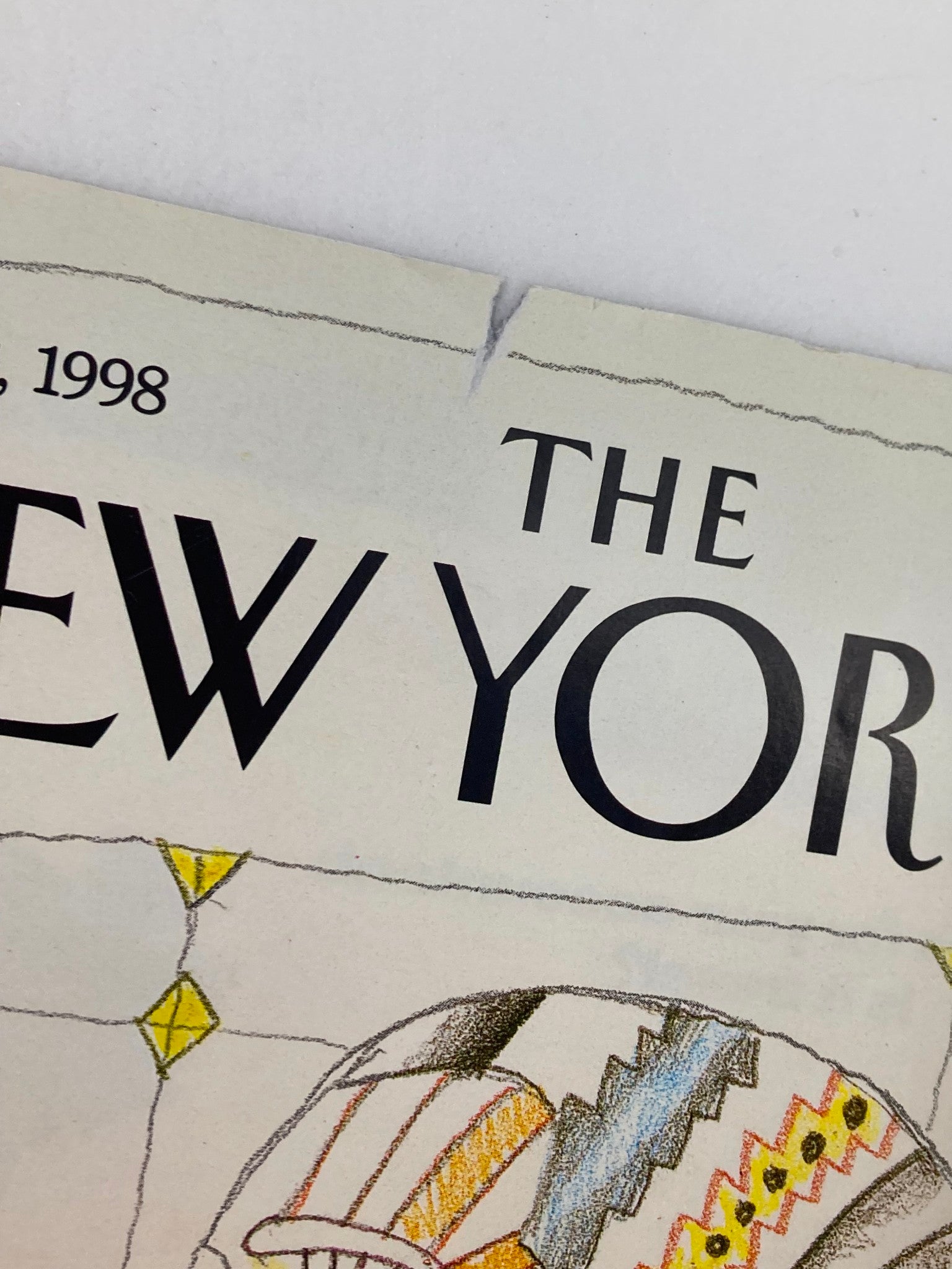 Close-up of the top section of The New Yorker cover, dated January 12, 1998, titled 'The Man in the Mirror' by S. Steinberg, highlighting tears and publishing information.