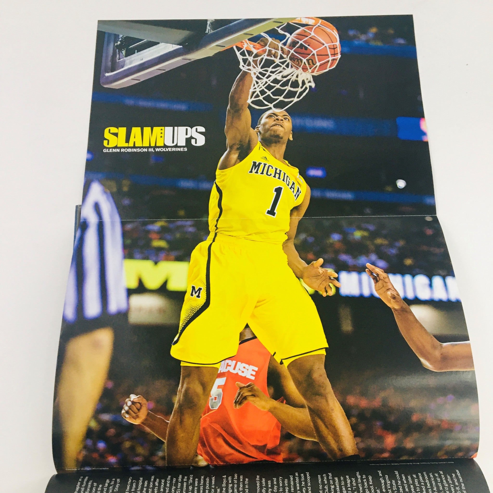 Poster from Slam Magazine November 2013 displaying Glen Robinson III of the Michigan Wolverines dunking during a game.