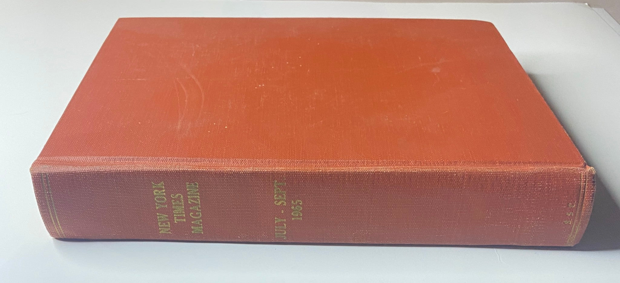 Spine view of The New York Times Library Edition Bound Magazine 1965 July - September featuring the title embossed in gold, showcasing its collectible quality.