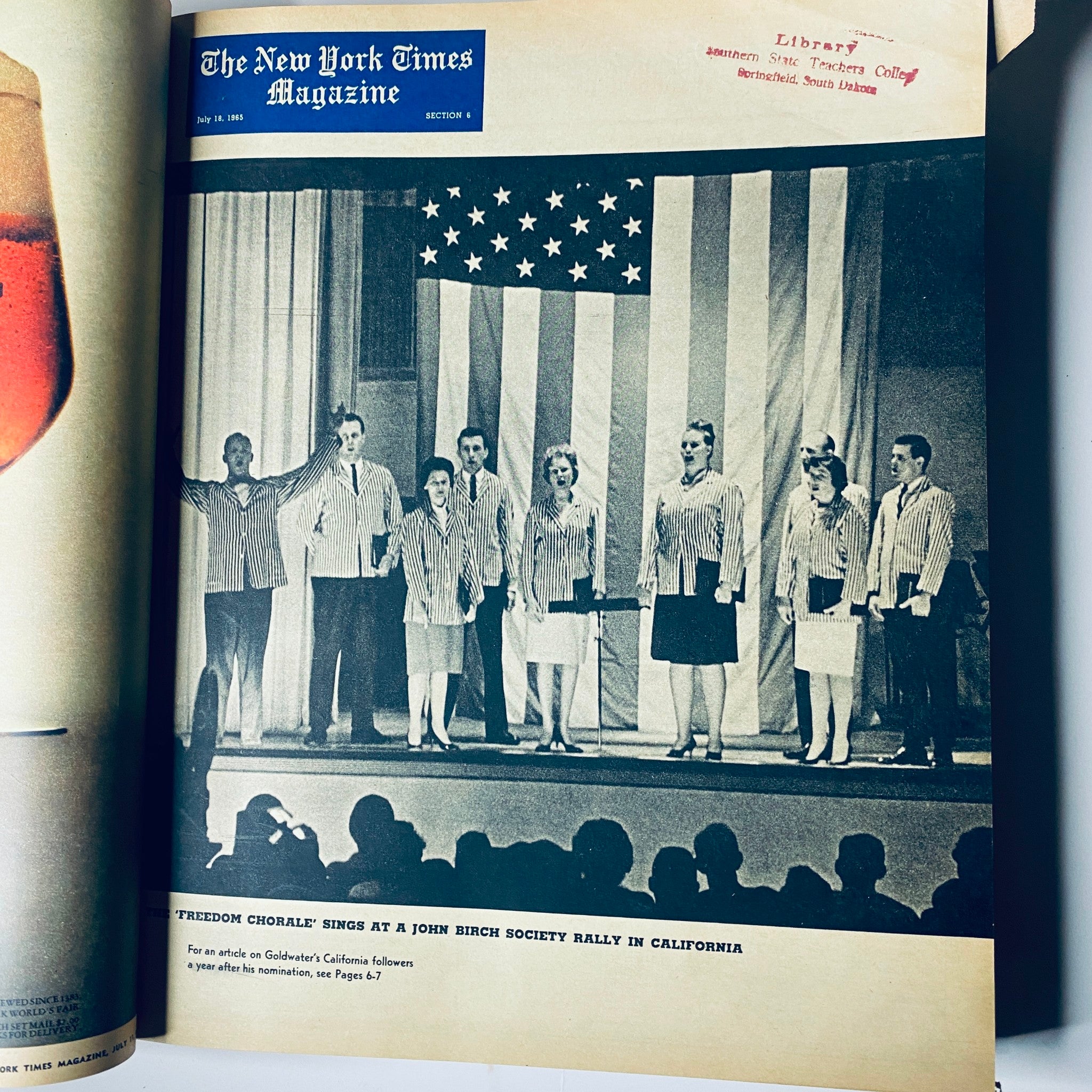 Performance scene from The New York Times Magazine July 14, 1965, showing the Freedom Chorale singing at a John Birch Society rally in California, against a backdrop of the American flag.