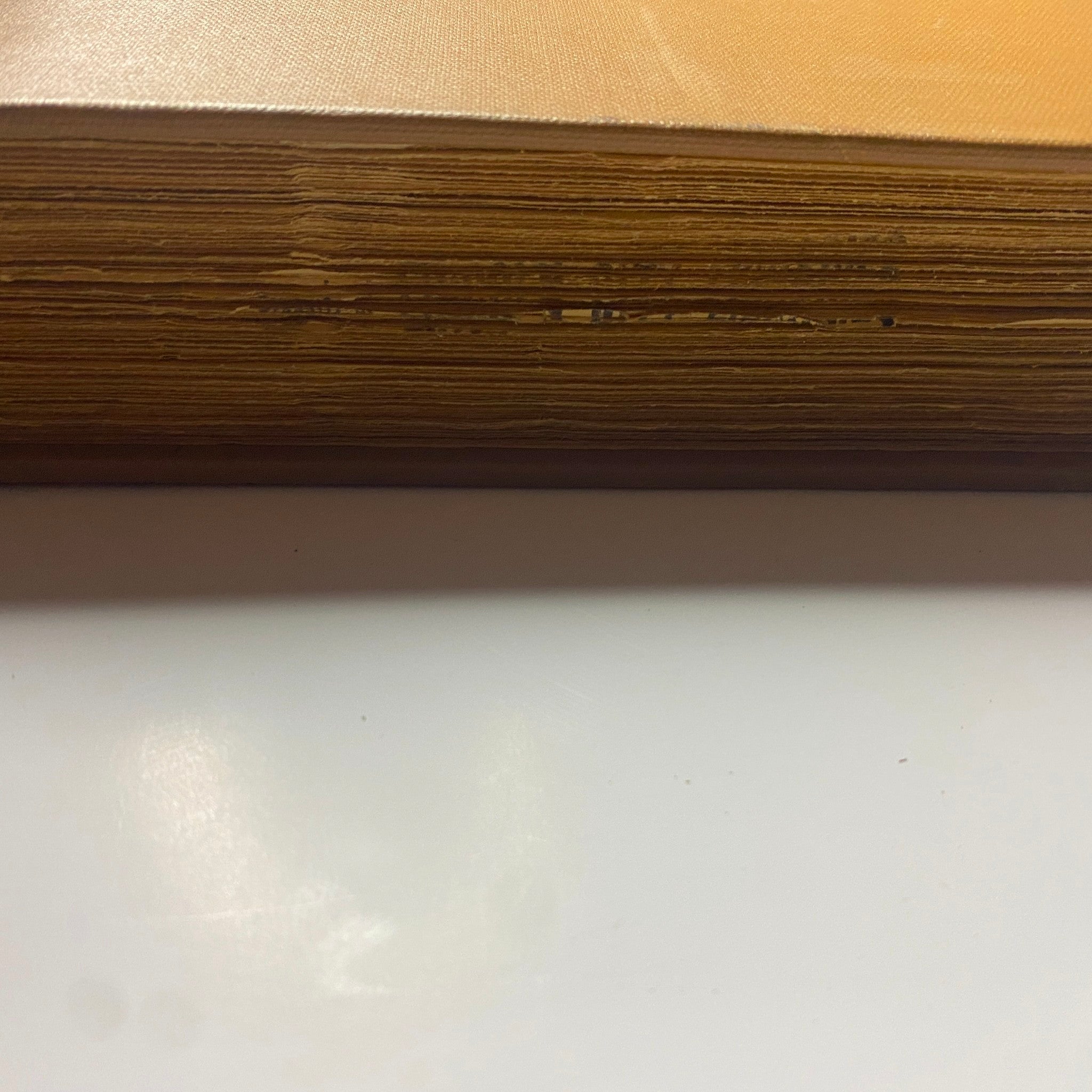 Close-up of the edges of The New York Times Library Edition Bound Magazine 1968, illustrating the aged and textured pages.