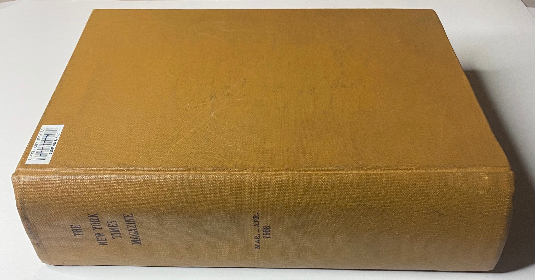Side view of The New York Times Library Edition Bound Magazine March - April 1968, highlighting the golden spine embossed with the title.