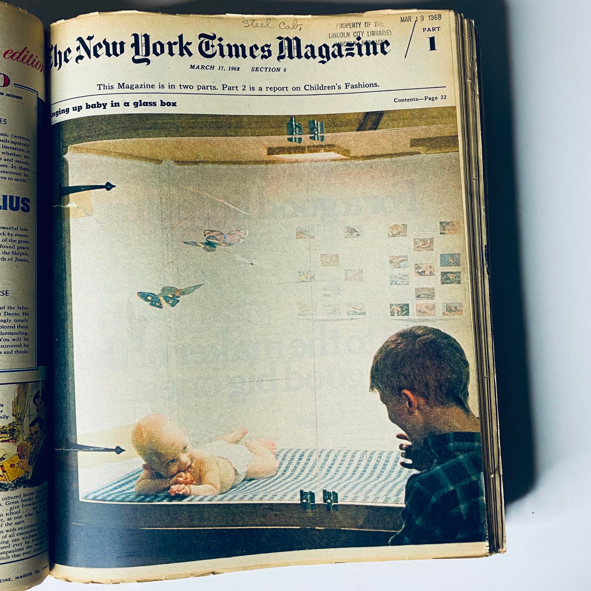 Interior page of The New York Times Magazine March 17, 1968 showing a baby in a glass box, part of a feature on children's fashions.