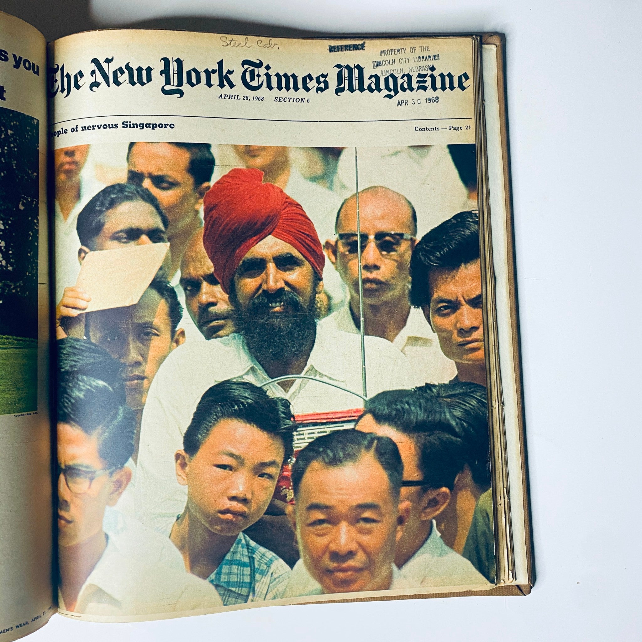 The New York Times Library Edition Bound Magazine 1968 March - April displaying a captivating image from April 21, 1968, showing a crowd in Singapore with a focus on a man in a red turban.
