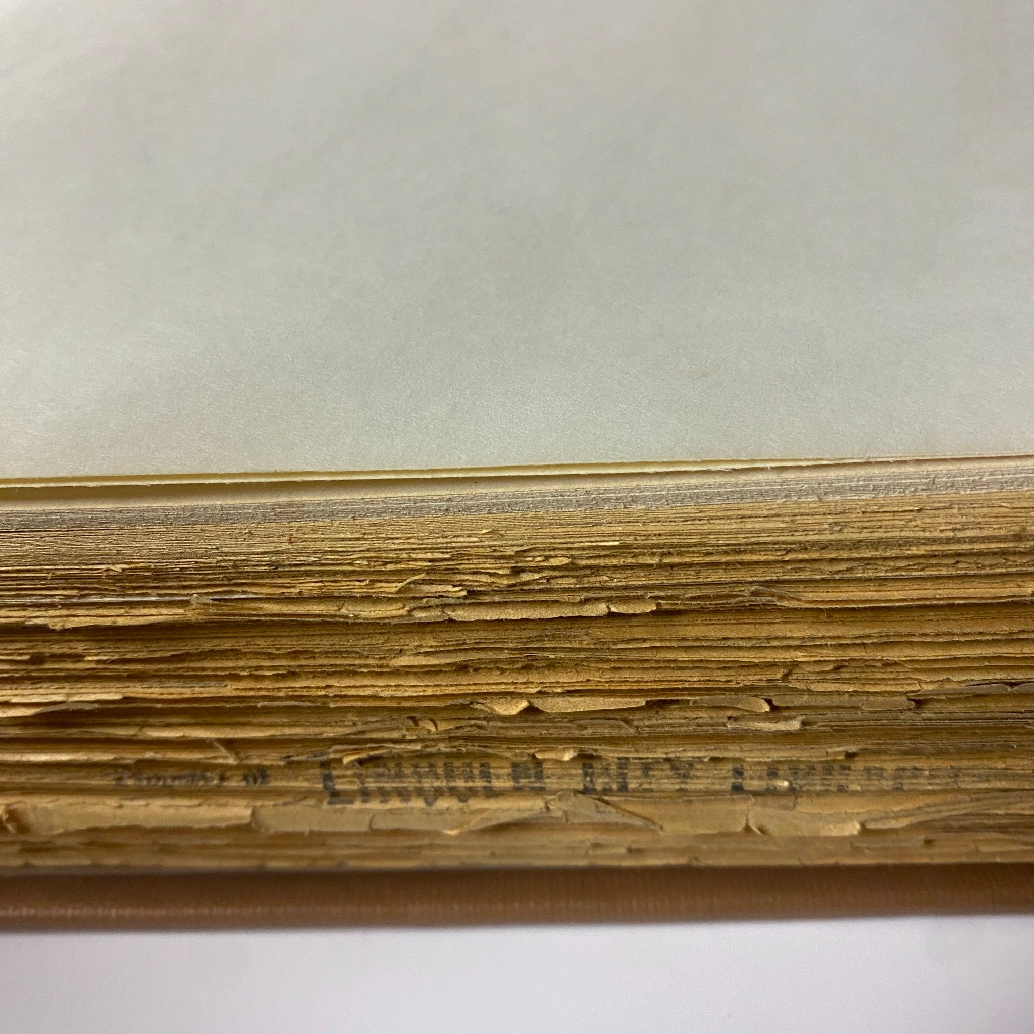 Close-up of the page edges of The New York Times Library Bound Magazine 1968 November - December, showing wear and library markings.